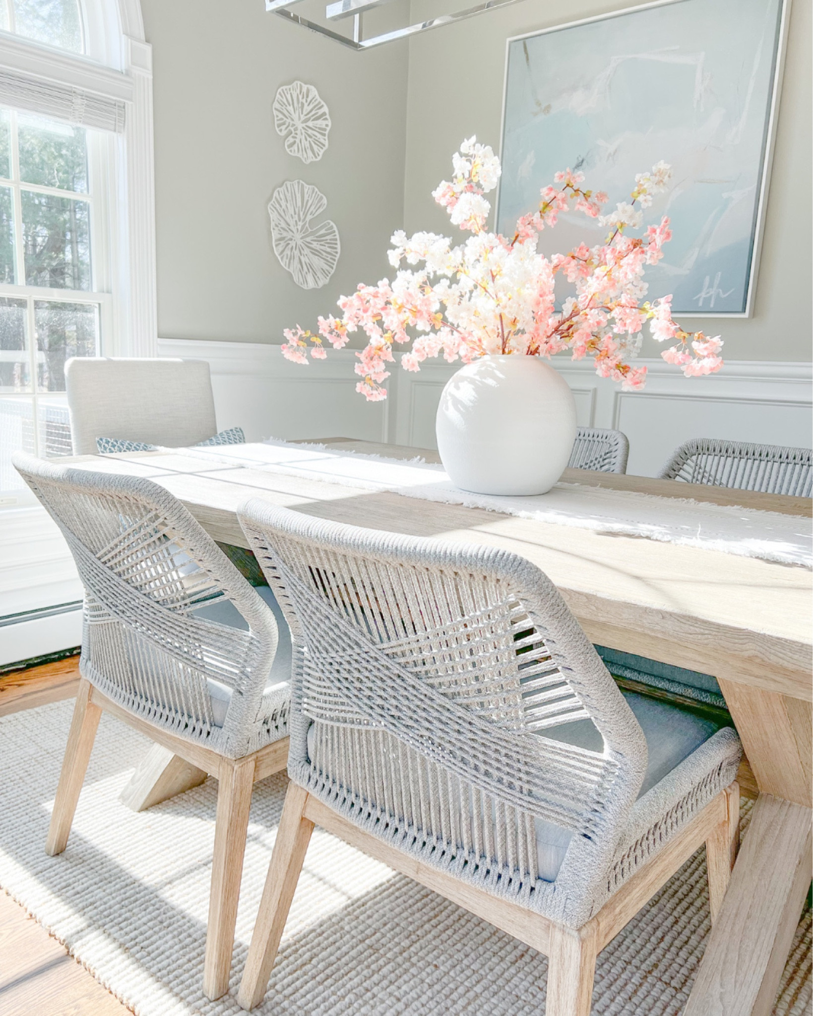Spring is officially here! D.C's cherry blossoms just hit their earliest peak bloom & it reminded me of how much I love having these pretty Amazon cherry blossoms out in my home at this time of year! 
-
coastal spring decor, spring decor under $50, spring decorations, spring home decorations, spring florals, cherry blossom stems, white cherry blossoms, pink cherry blossoms, spring flowers, dining room table decor, dining room decor, coastal decor, beach house decor, beach decor, beach style, coastal home, coastal home decor, coastal decorating, coastal interiors, coastal house decor, beach style, large white vases, linen table runner, spring table runner, neutral table runner, dining room chairs, rope chairs, gray dining room chairs, coastal dining chairs, dining room table, pottery barn dining table, natural wood table, dining room rug, neutral rug, coastal rugs, jute jug, wool rug, pottery barn rugs, 5x8 rugs, 8x10 rugs, wall art, coastal wall decor, abstract artwork, coastal artwork, blue artwork, blue abstract art, dining room decor, dining room pendant light, dining room lighting, Amazon cherry blossoms, Amazon flowers, Amazon faux flowers, spring flowers  

#LTKSeasonal #LTKstyletip #LTKhome