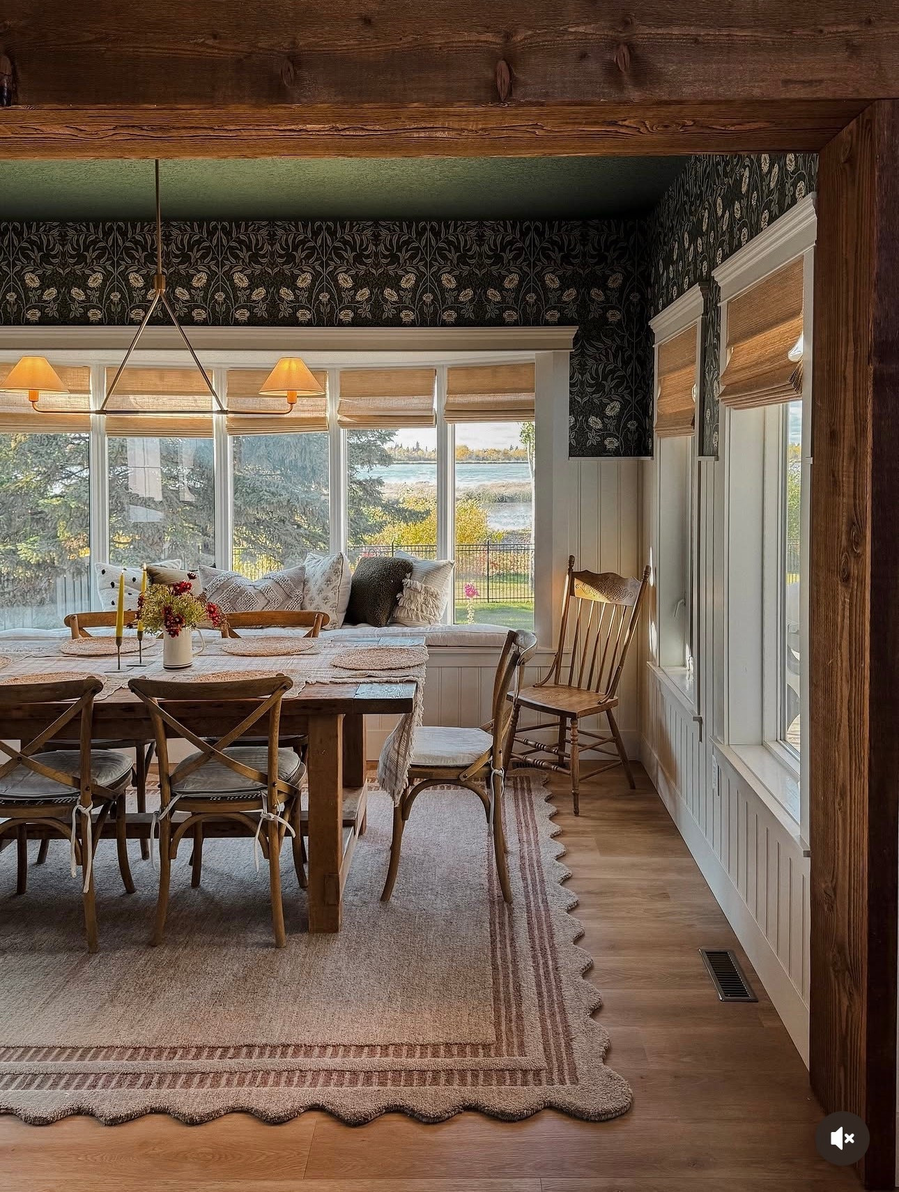 Modern cottage dining room, green floral wallpaper, scalloped chrislovesjulia x loloi  rug, twopages bamboo shades, wainscoting, linear chandelier 

#LTKHome