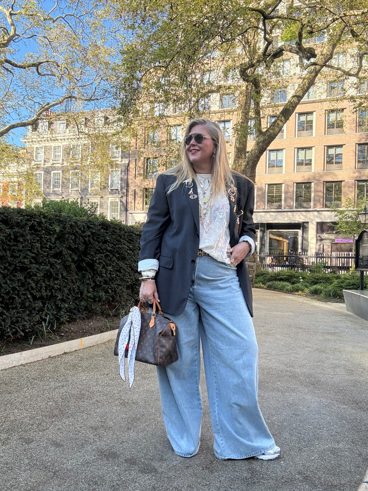 Pinstripe blazer, wide leg jeans, trainers, floral sheer top, brooches, sunglasses, tote bag 

#LTKsummer #LTKplussize #LTKjeans