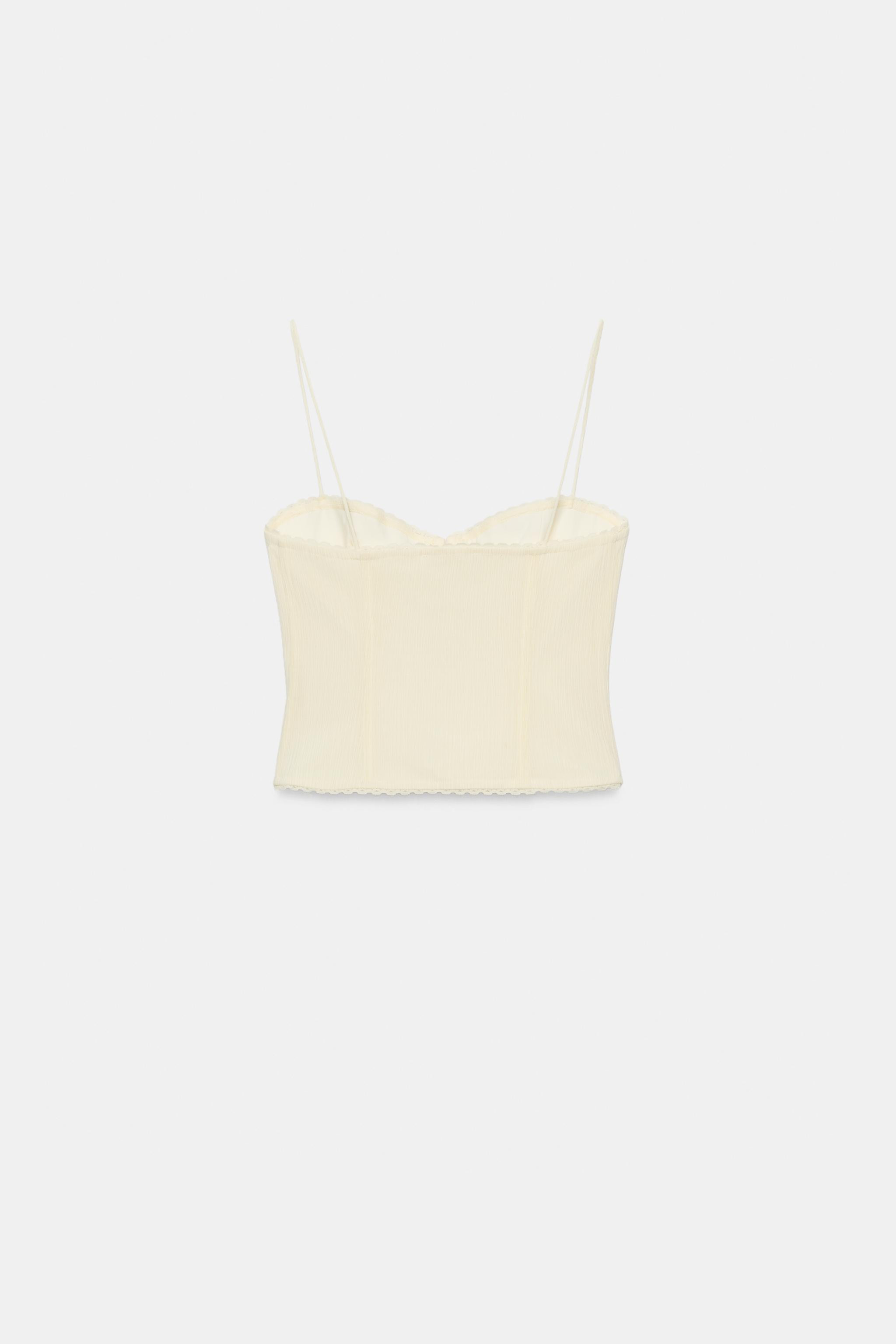 Sweetheart neckline top with spaghetti straps. Features visible seam detailing and floral appliqu... | Zara US