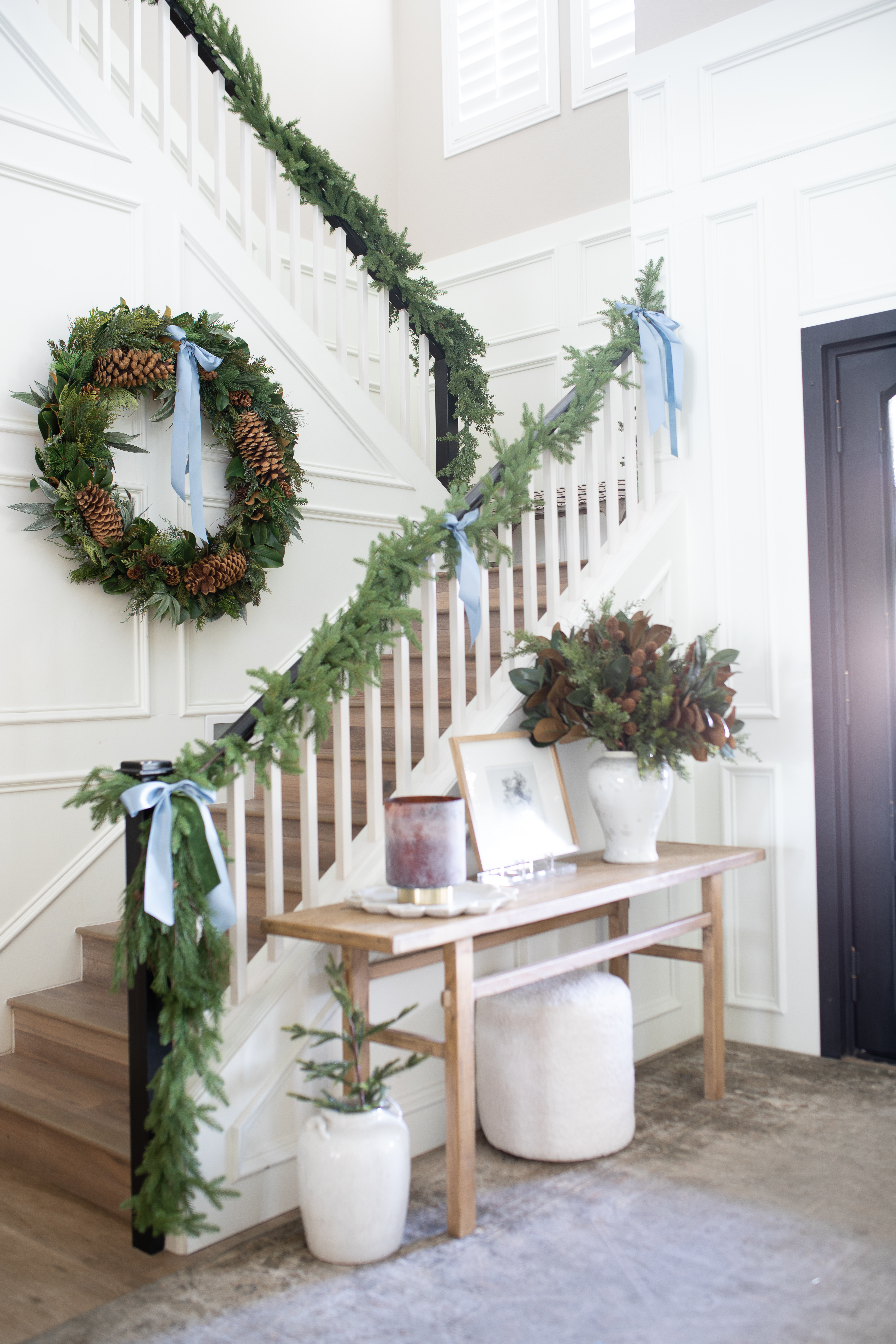 Stepping back in time snd remembering the holiday season I decided to decorate a touch of elegance using one of my favorite colors blue. 🩵

I was all about soft, calming tones for Christmas, starting right at the entryway. The light blue ribbon added a little charm that paired perfectly with the garland draped over the staircase. 

With all the Arizona sunlight pouring in, it felt sooooo cozy every time I walked to the door.

Linking some pieces if you want to recreate this look this holds season! 

#LTKHome