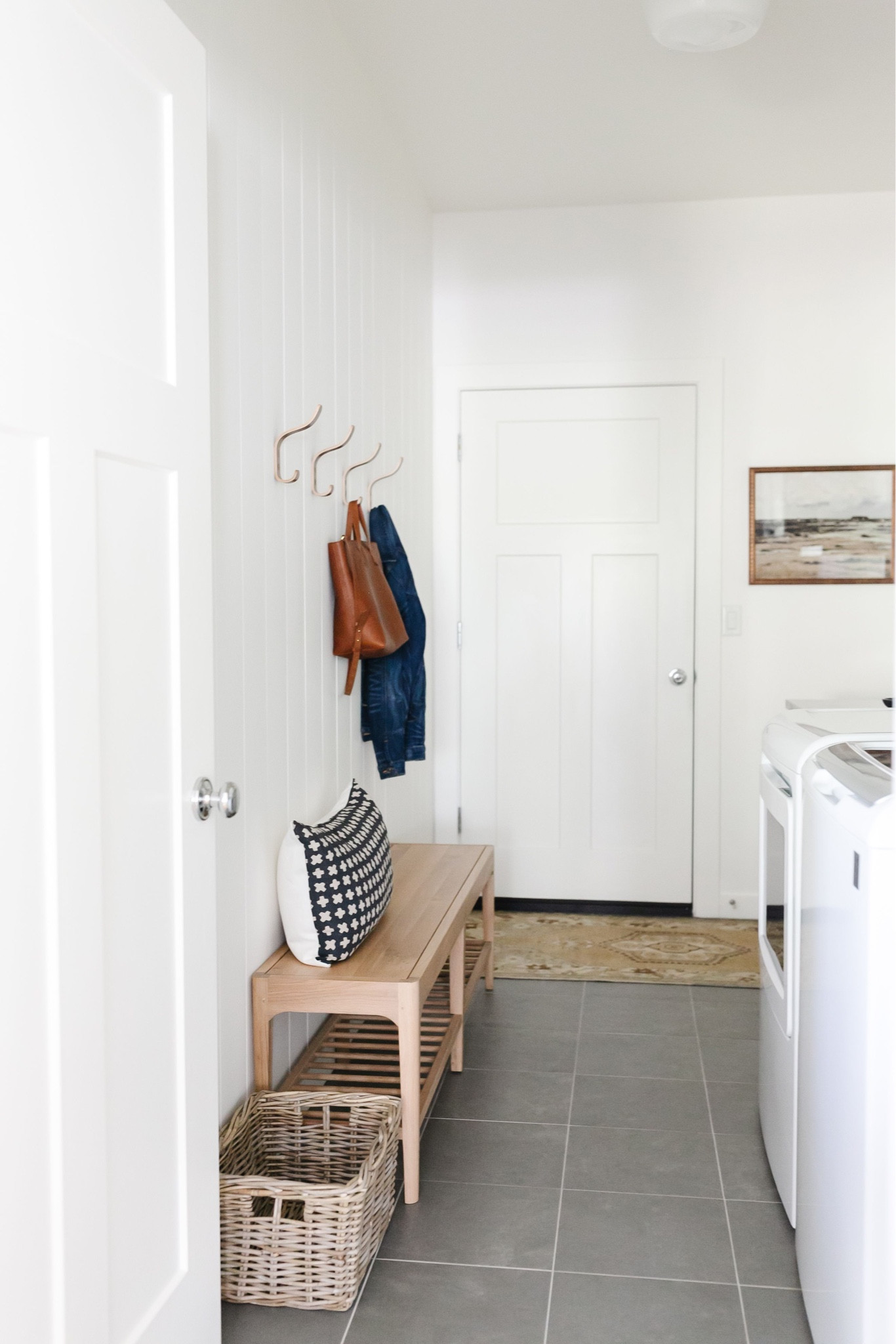I styled my laundry mudroom with a white oak bench, Amazon hooks above it, basket, vintage rug

#LTKstyletip #LTKFind #LTKhome