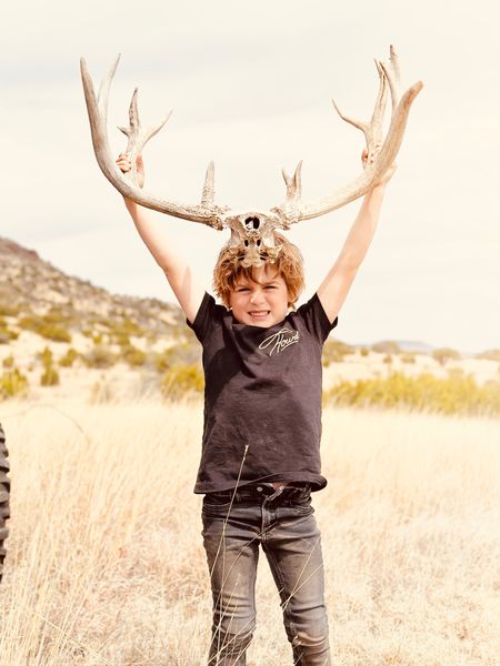 We won’t hiking and stumbled across these horns. It made for such a cute pic- glad Boyce picked his howdy shirt for the day! 
We have a few - all of the styles - and he boys look so cute in them. 

#LTKfamily #LTKunder50 #LTKFind