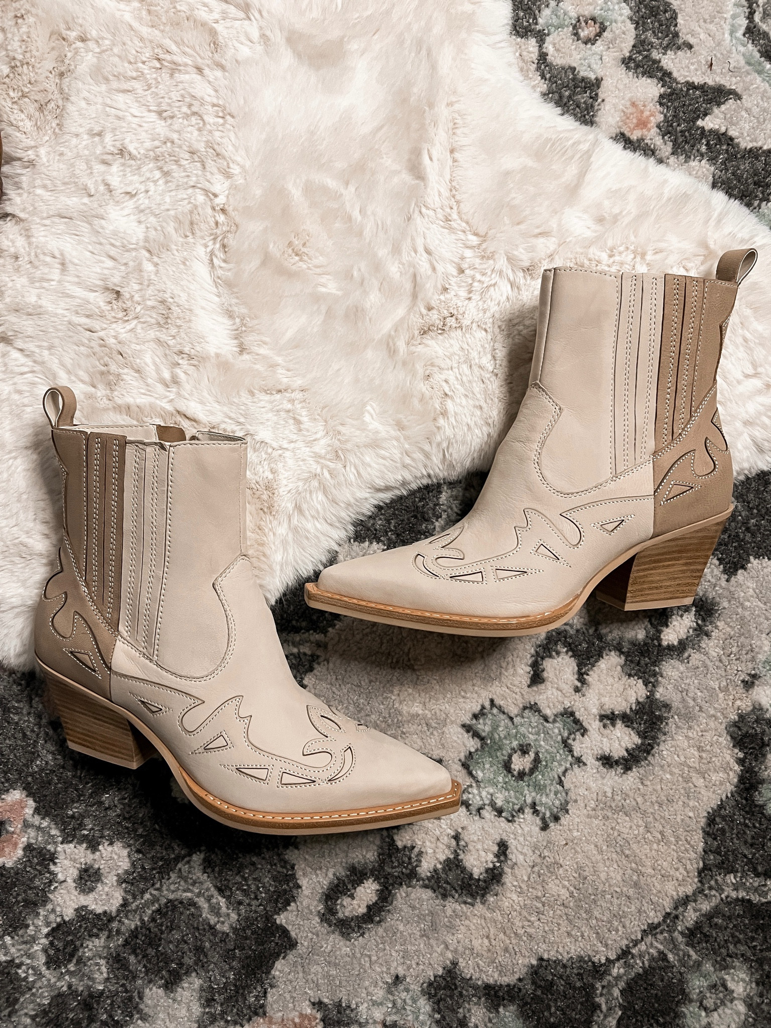These neutral two tone western booties caught my eye the minute I saw them! They’re comfortable too. Comes in solid darker suede and black/white leather. I sized down a half size (from 9 to 8.5) despite the pointy too! 

#LTKxNSale #LTKsalealert #LTKshoecrush