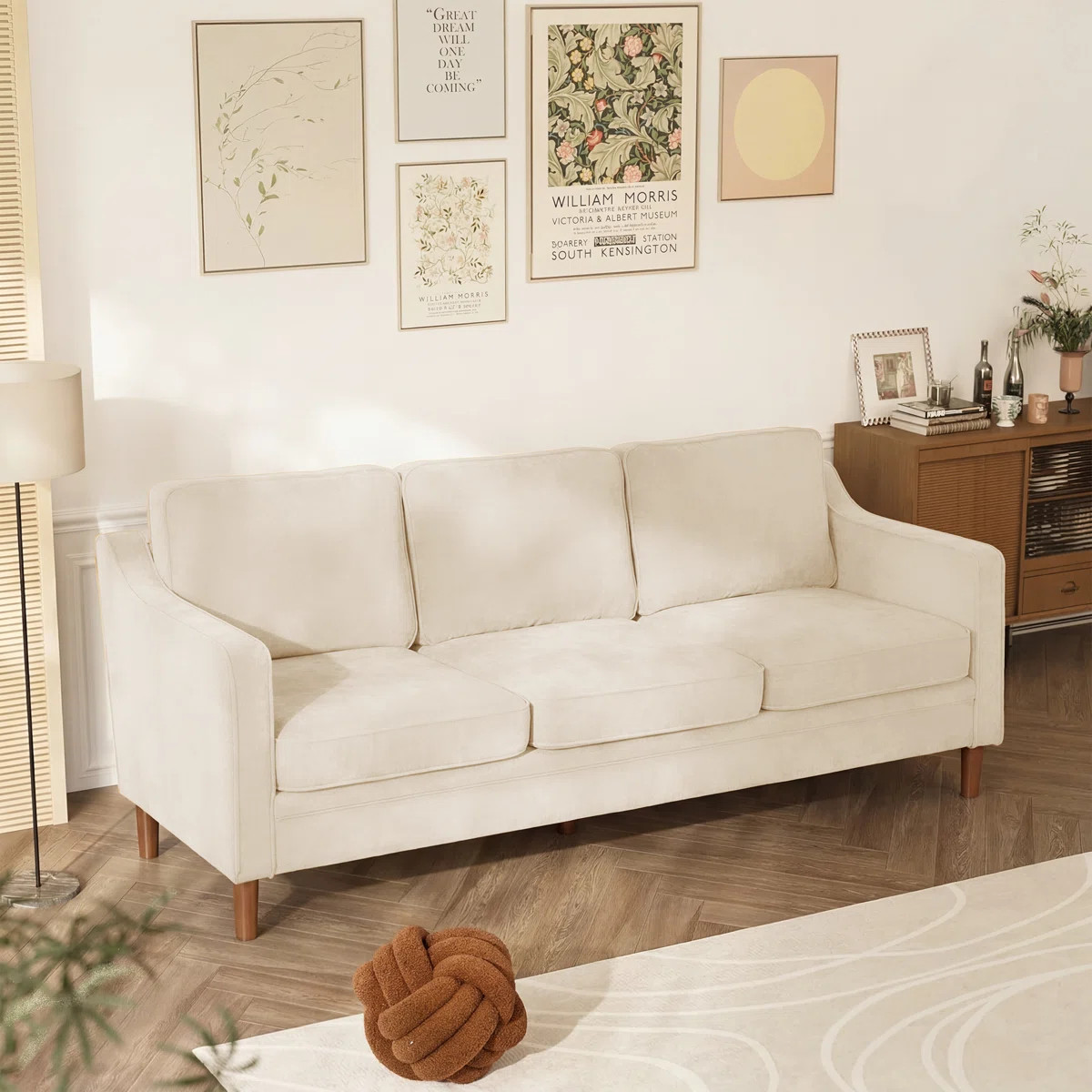 Unwind in style with this spacious and clean-lined upholstered sofa. The solid and engineered woo... | Wayfair North America