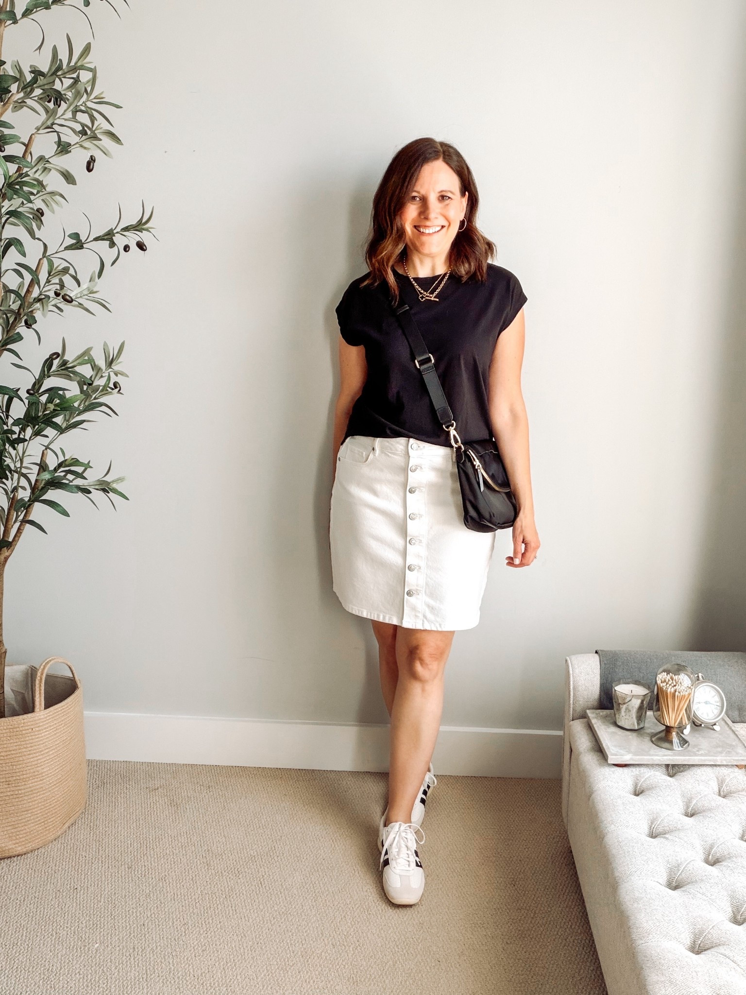 I’m glad to see short denim skirts making a comeback after maxi skirts took center stage the past few years. This one from LOFT has buttons down the front that create a vertical line and draw the eye up and down. You can easily wear it dressed up with sandals or create a casual look with sneakers. I sized up for an easy fit and to avoid any button pulling. A great option when you want something that hits above the knees, but not as revealing as shorts. I’m wearing this tee in an extra small. It fits big. I own it in several colors. 

#LTKMidsize #LTKOver40 #LTKSaleAlert