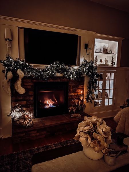 Fireplace mantle decoration for Christmas and the holidays with garland and stockings hung 

#LTKhome #LTKHoliday #LTKSeasonal
