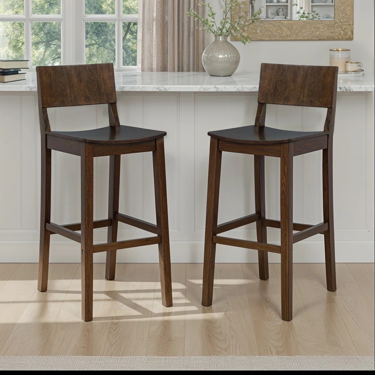 This 2-piece counter stool set brings a modern, Scandi-inspired touch to your kitchen or dining area. Crafted from kiln-dried solid wood, these stools showcase a natural wood grain variation that adds a little rustic charm to your space. 

#LTKHome