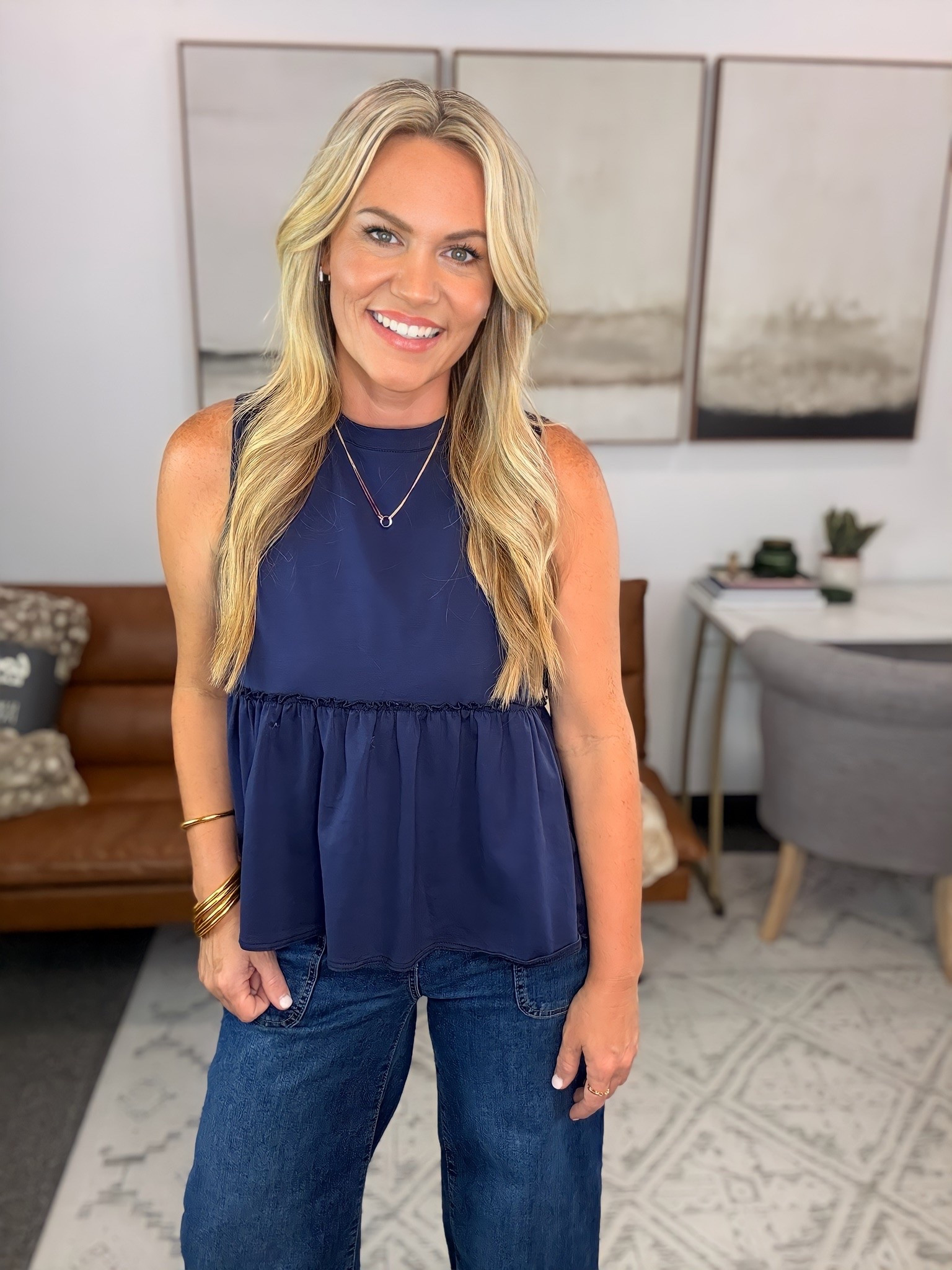 This top has that easy, throw-it-on feel, but the flowy hem gives it a little more personality than a basic tank. I paired it with dark wash wide-leg jeans because the structured denim balances the relaxed fit perfectly, and it’s one of those outfits that works from a full day at the office to dinner after.

Navy sleeveless top, babydoll tank, wide leg jeans, dark wash denim, office casual outfit, teacher style, everyday fashion, transitional outfit, fall wardrobe, AudrieDollins

#LTKootd #LTKSeasonal #LTKOver40