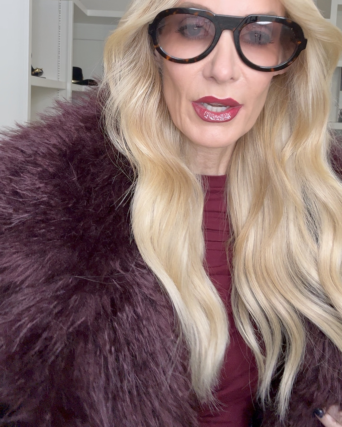 Burgundy is having such a moment, and this outfit is proof 🫦

This top is unbelievably soft — like second-skin soft — and I’m obsessed with the thumb holes and subtle gathering. It’s super flattering and incredibly slimming, plus this rich burgundy shade is just gorgeous on.

I paired it with my new favorite Mother Jeans — a high-waisted baby flare that is so slimming and makes your legs look miles long. Truly one of those jeans you reach for again and again.

Then I topped everything off with this fabulous burgundy faux fur because… why not? 

And this suede burgundy handbag is chef’s kiss — beautiful gold detailing, so classy and elegant, and it comes in five different colors.

Everything runs true to size.
I’m wearing an XS in the top and jacket and a 24 in the denim.

Would you wear this rich burgundy head-to-toe look? 🍷✨

#Over40Style #ChicAtAnyAge #BurgundyStyle #FallFashion #ElevatedBasics #DenimStyle #EffortlessChic

#LTKgrwm #LTKHoliday #LTKOver40