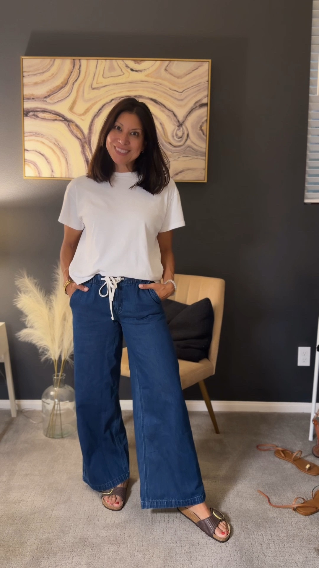 Casual wide leg pant outfit 

@American Eagle Outfitters 
Wearing xs jeans 

Sandals size 38

#LTKSeasonal #LTKOver40 #LTKPetite