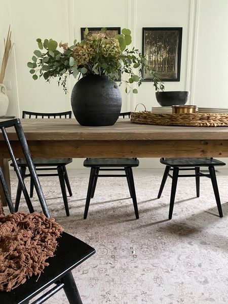 A warm table setting. 
Neutral, black vase, dinnerware 

#LTKSeasonal #LTKhome