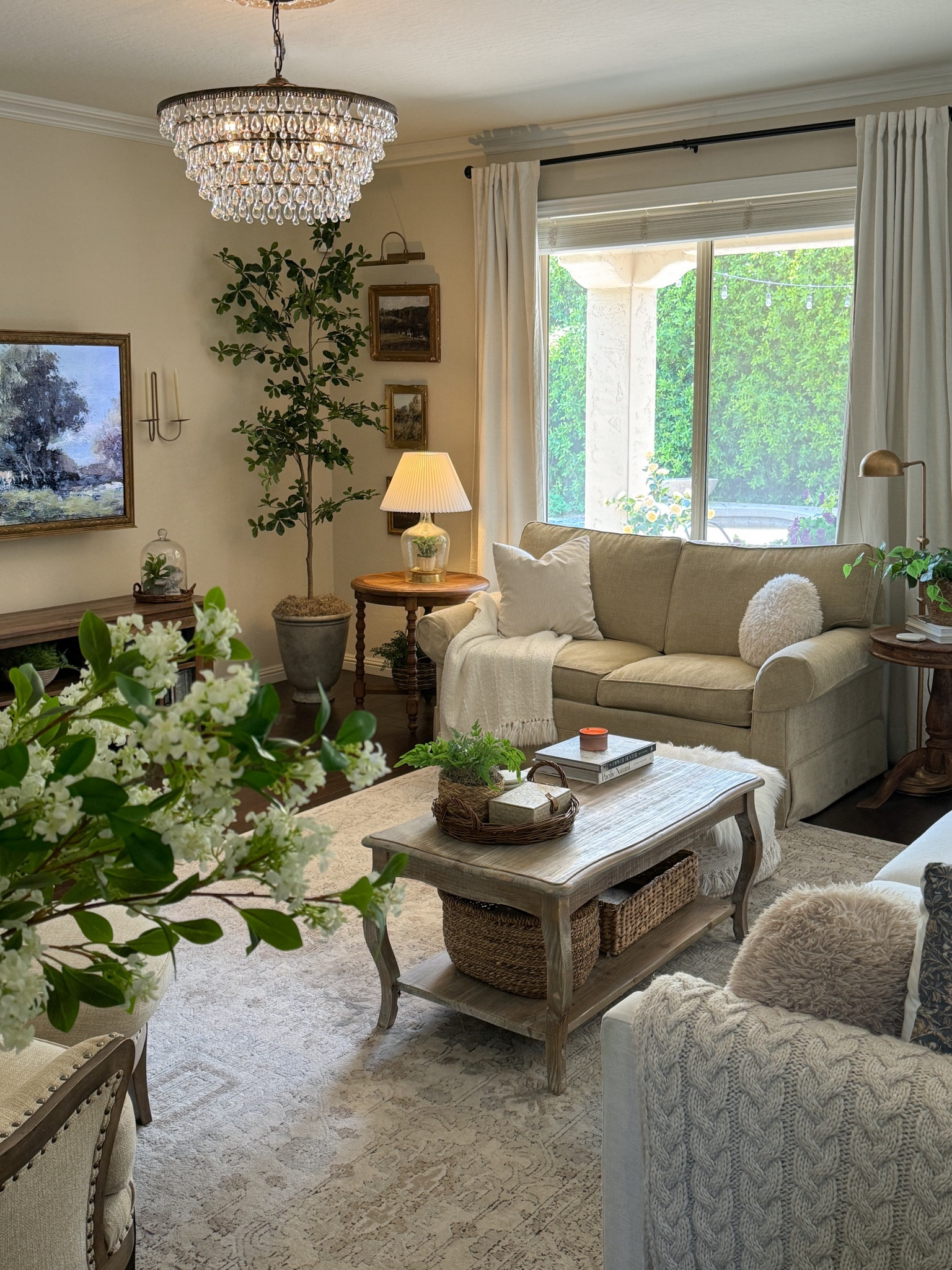 Items from my living room. 

I used European Gold Rub n Buff on the reading lamp, the art light and the candle sconces. 

We made our own frame for the TV. 

#livingroom #frenchcountry #chandelier #coffeetable #olivetree #amazonhome #founditonamazon

#LTKHome
