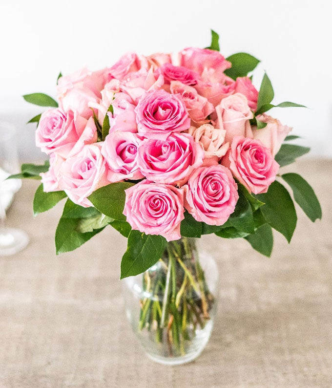 Two Dozen Light Pink Long Stem Roses in a Clear Glass Vase | From You Flowers
