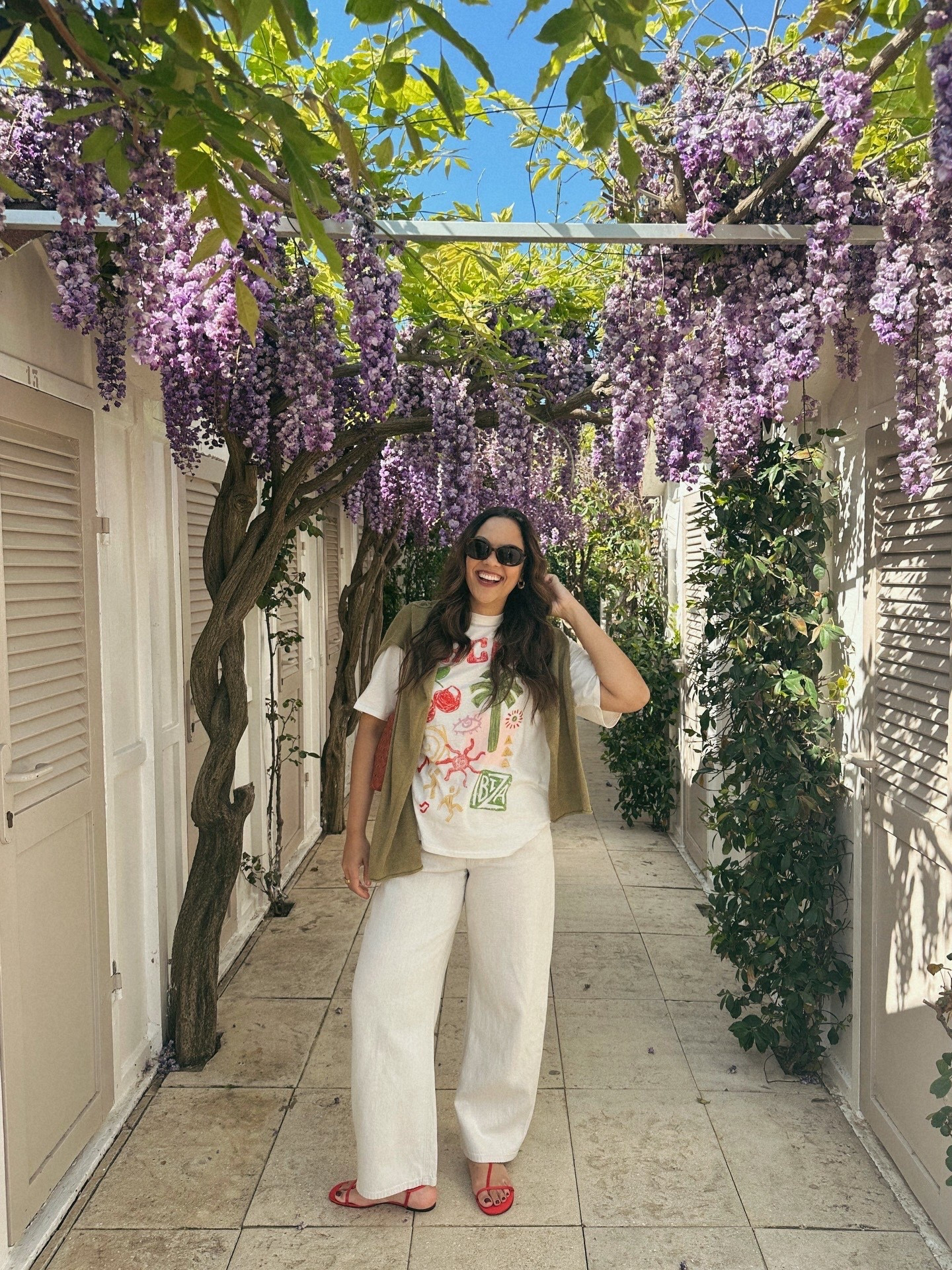 Italy beach outfit!
-H&M graphic tee, I have a large. 
-Massimo Dutti cream barrel jeans, I have a size 8. 
-Massimo Dutti green sweater, I have a large. 
-Reformation red sandals. 
-Anthropologie brown woven bag. 
-Celine Triomphe sunglasses  

#LTKcanada #LTKtravel #LTKstyletip