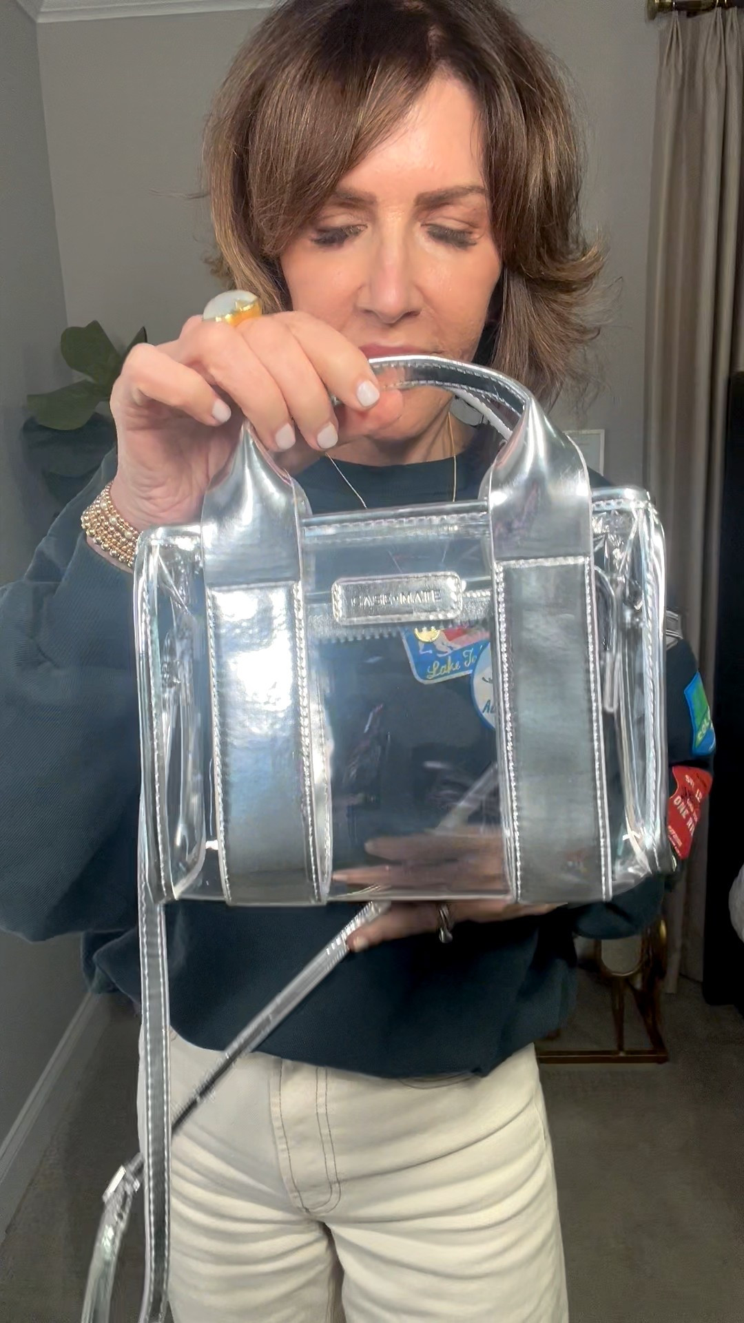 clear handbag, graphic pullover, wide leg pants, gold jewelry 

#LTKSeasonal #LTKootd #LTKOver40