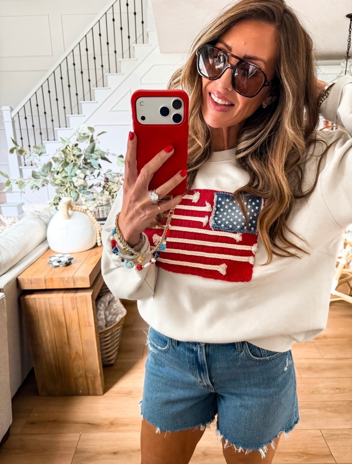 This patriotic sweatshirt is one of those pieces you’ll pull out year after year. The textured flag detail makes it feel elevated, and it’s perfect for cool summer nights, Fourth of July celebrations, lake weekends, and everyday casual wear. Paired with denim shorts, it’s an easy outfit that feels festive without trying too hard.

patriotic sweatshirt, American flag sweater, Fourth of July outfit, summer sweatshirt, denim shorts outfit, lake day style, casual summer look, red white and blue fashion, holiday weekend outfit, USA style, summer wardrobe staple, patriotic fashion, everyday casual outfit, themominstyle

#LTKSeasonal #LTKOver40 #LTKootd