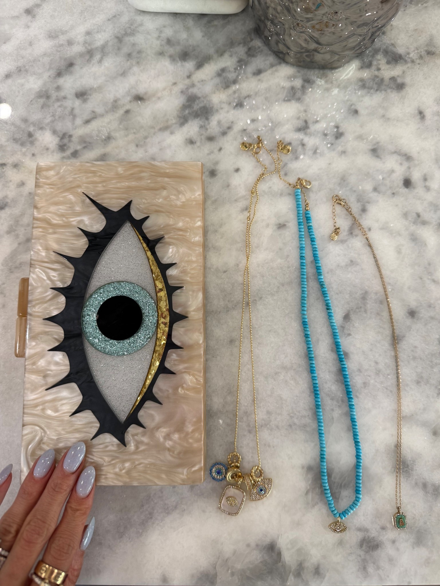 Evil eye necklaces I love! And clutch 