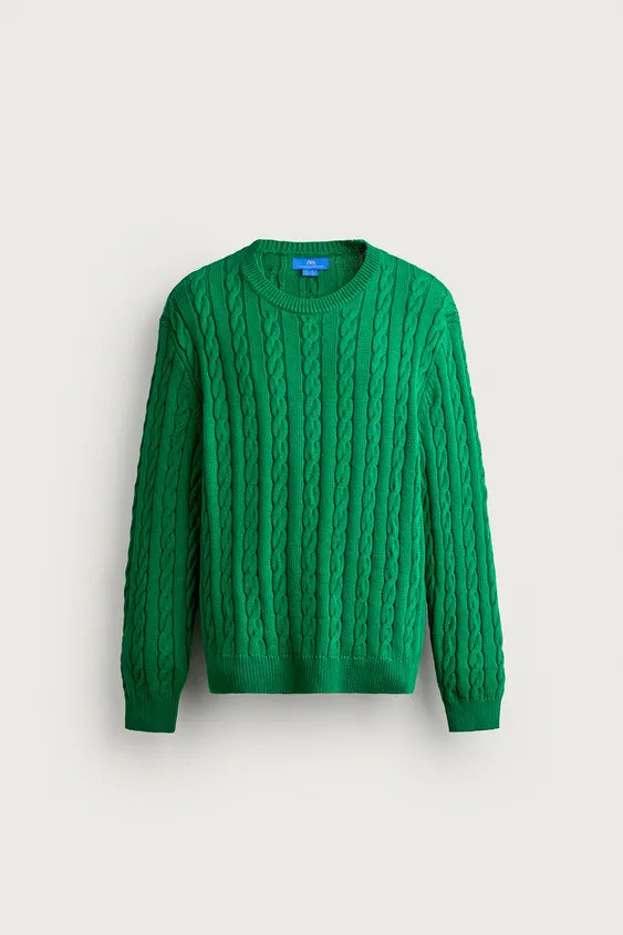 Model height: 188 cmRegular fit knitted jumper made from a cotton blend yarn. Featuring a round n... | Zara UK