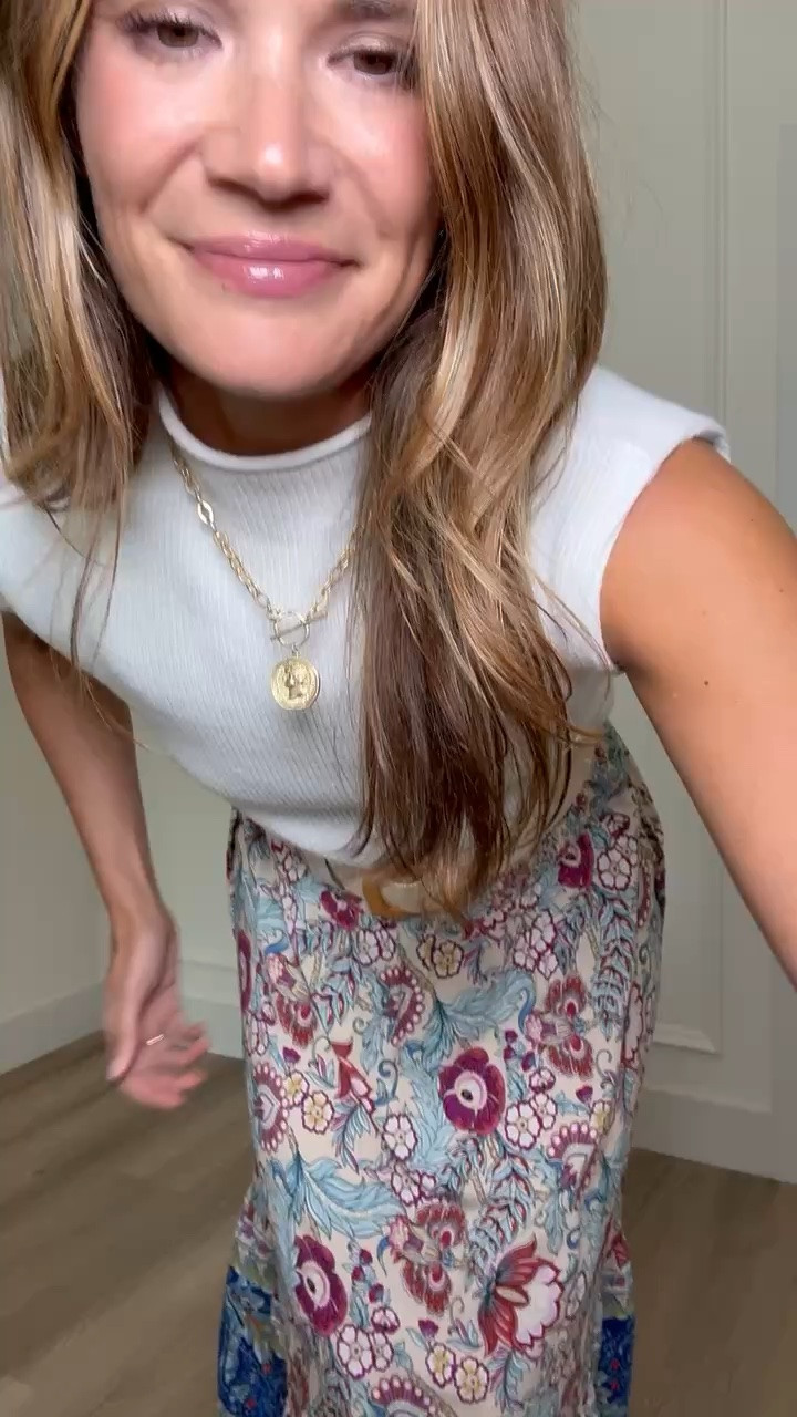 This skirt is one of those pieces that makes a simple outfit feel so put together. The colorful print adds just the right amount of interest, while the flowy midi length keeps it comfortable for warm days. I paired it with a classic white knit tank and a woven belt for an easy look that works for brunch, church, or a casual date night.

Printed midi skirt, white knit tank, summer outfit, colorful skirt, feminine style, brunch outfit, vacation style, lightweight outfit, woven belt, everyday fashion, tall girl style, StangandCo

#LTKootd #LTKWorkwear #LTKSeasonal