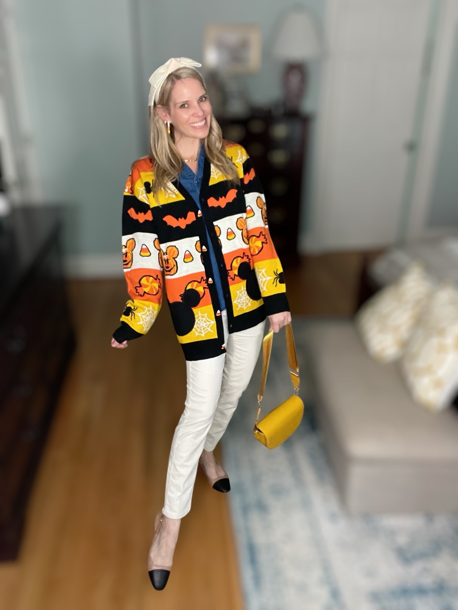 🎃👻 Spooky season style, but make it chic! 🍬 I’m wearing the cutest Her Universe Disney Halloween Mickey Mouse Cardigan layered over a classic Talbots Denim Button Front Shirt and paired with Talbots Stretch Corduroy Leggings for a polished fall look. The cardigan is such a fun statement piece with candy corn, pumpkins, bats & Mickey Mouse—perfect for Halloween parties, Disney trips, or cozy fall nights! 🧡🖤

I styled it with a Luna Crossbody Bag in a golden yellow that ties back to the candy corn vibes 🍯, plus my Lele Sadoughi Ivory Sheer Shirley Headband for that feminine touch. To finish, I added a little sparkle with Candy Corn Earrings (BaubleBar & Kendra Scott both make darling options!) that tie the whole look together. ✨

This outfit blends Disney Halloween fashion, fall outfit inspo, cozy cardigan layering, and feminine accessories—making it both festive & wearable. 🕸️🧡

✨ Shop the exact look & similar styles below! ✨


#LTKItBag #LTKShoeCrush #LTKFindsUnder50