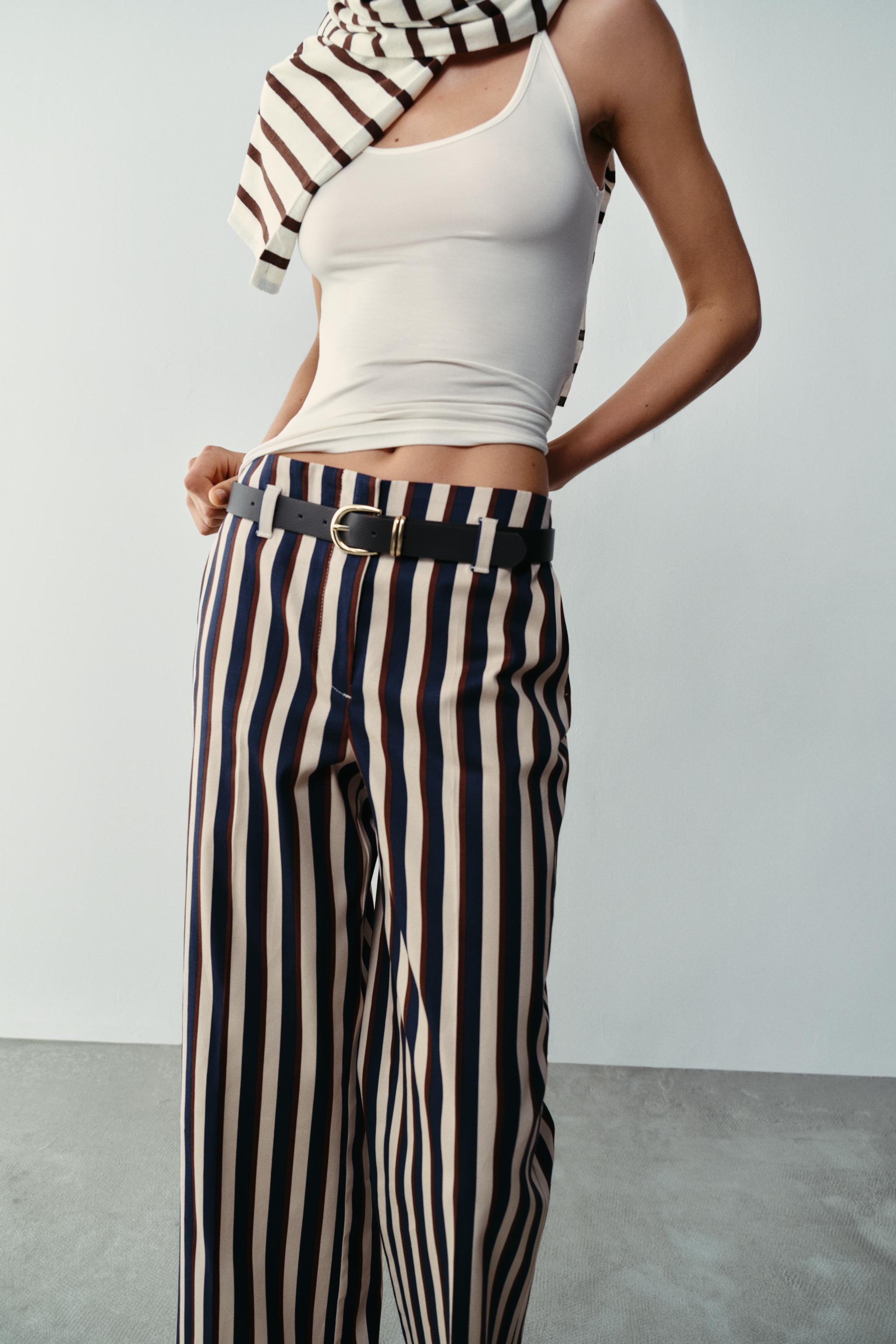 High-rise trousers with front pockets. Featuring a belt detail. Straight leg. Front zip, inside b... | Zara US