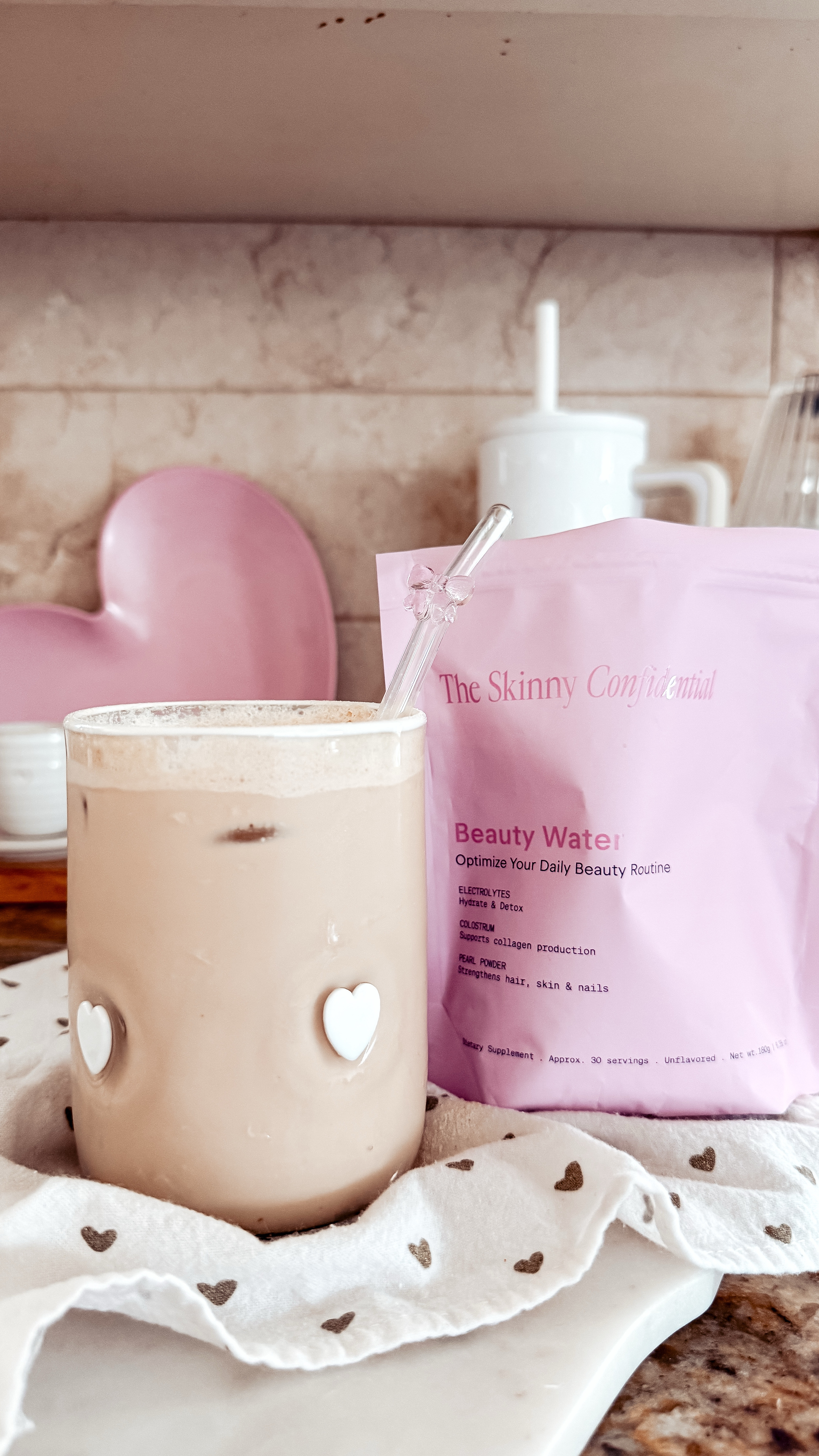 { beauty water ❥

full disclosure, I cannot drink this w. plain water, but mixed in my coffee .. . yes, please! 

The Skinny Confidential Beauty Water **use code TSCPARTNER to save!! 

Colostrum Powder . Anthropologie Icon Juice Glass in White Hearts . Glass Bow Hearts . Native American Content Creator } 

#LTKWatchNow #LTKBeauty #LTKHome