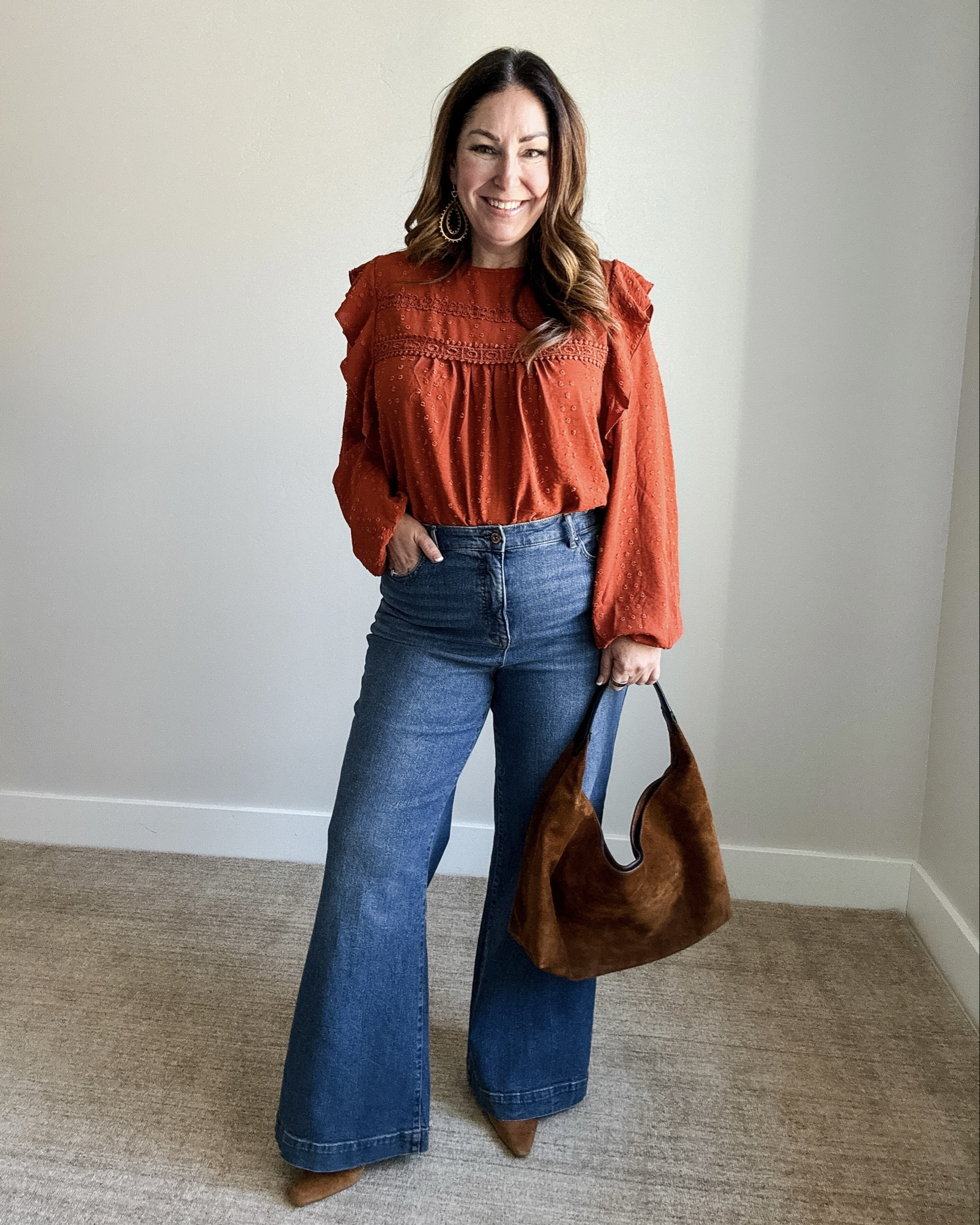 For Thanksgiving I like a dressy casual outfit that works for cooking and hosting and this one is PERFECT! This ruffle blouse comes in a ton of colors.  | Wearing top, L and pants, 32 

 #midsizestyle #thanksgivingoutfit #LTKSeasonal #LTKMidsize #LTKFindsUnder50