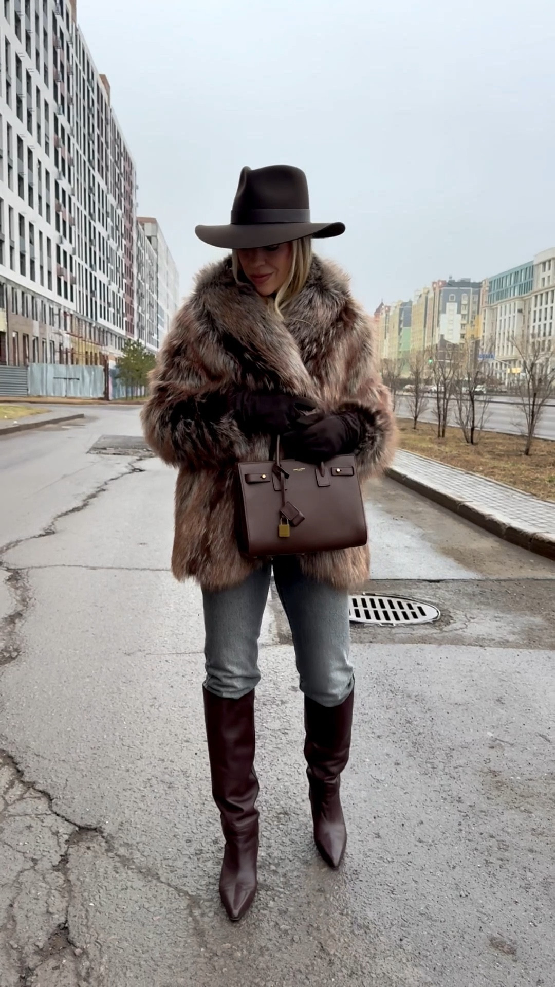 Faux fox fur coat, Zara chocolate brown mockneck tee, Levi’s gray jeans, dark brown western boots, western style winter outfit 

#LTKOver40 #LTKFindsUnder100 #LTKSeasonal