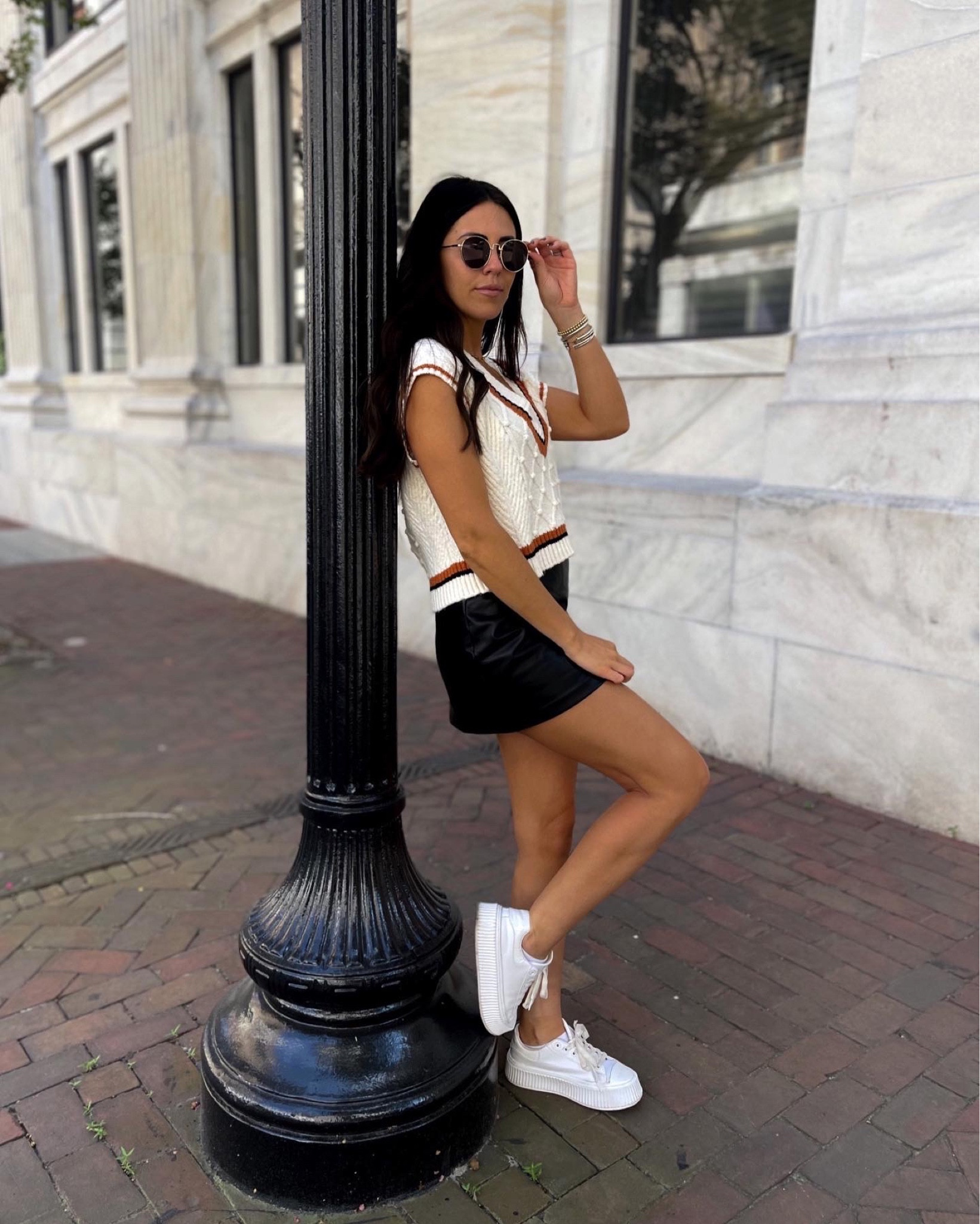 Sweater vest + faux leather skirts… edgy fall street style. Savannah city outfit inspo 

#LTKstyletip #LTKSeasonal #LTKunder100