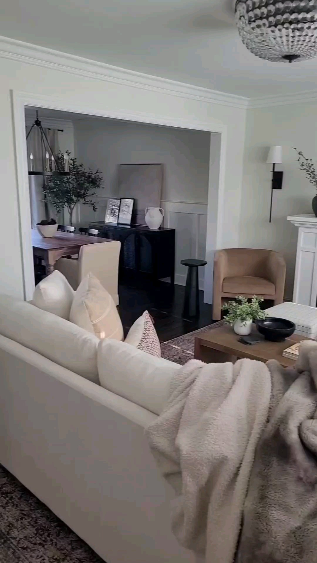 Cozy neutral living room with affordable coffee table,  electric fireplace, cube ottomans,  barrel chair and floor mirror!

#LTKHome #LTKWatchNow #LTKFindsUnder100