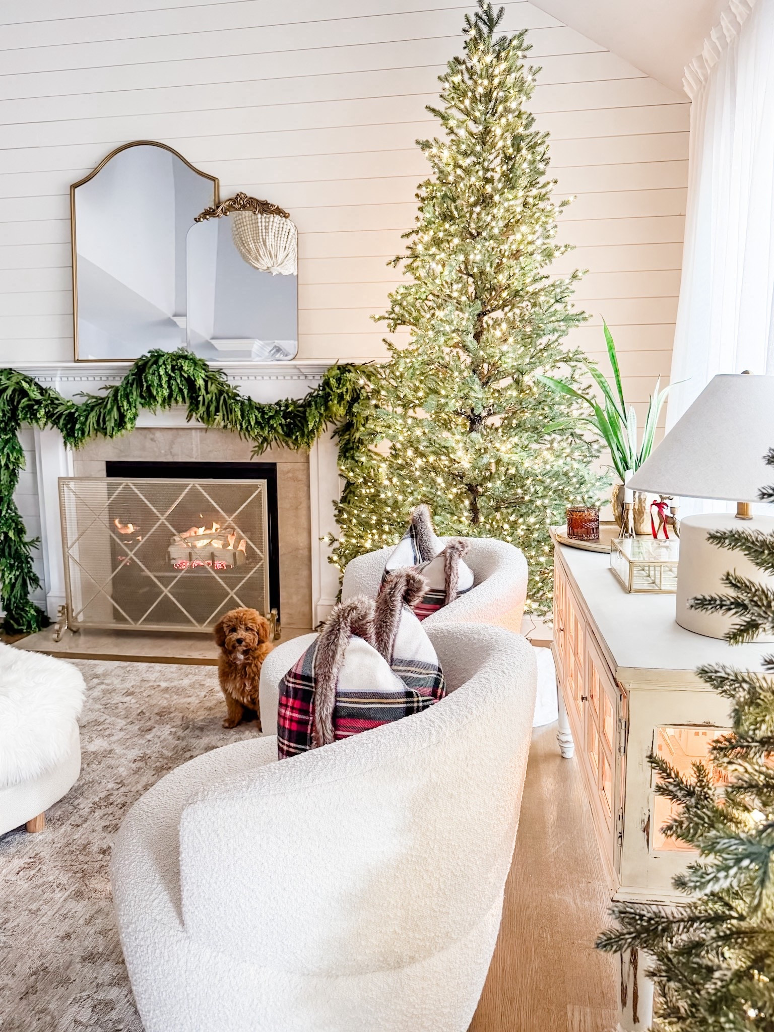 Christmas decor
Christmas living room
Christmas mantel
Holiday decor
Christmas tree
Elegant grand fir
Artificial 9 ft Christmas tree
Cedar garland
Norfolk pine garland 
Bouclè swivel chair
Table lamp
Round ottoman
Fire screen
Fireplace screen
Living room rug


#LTKSeasonal #LTKHome #LTKHoliday