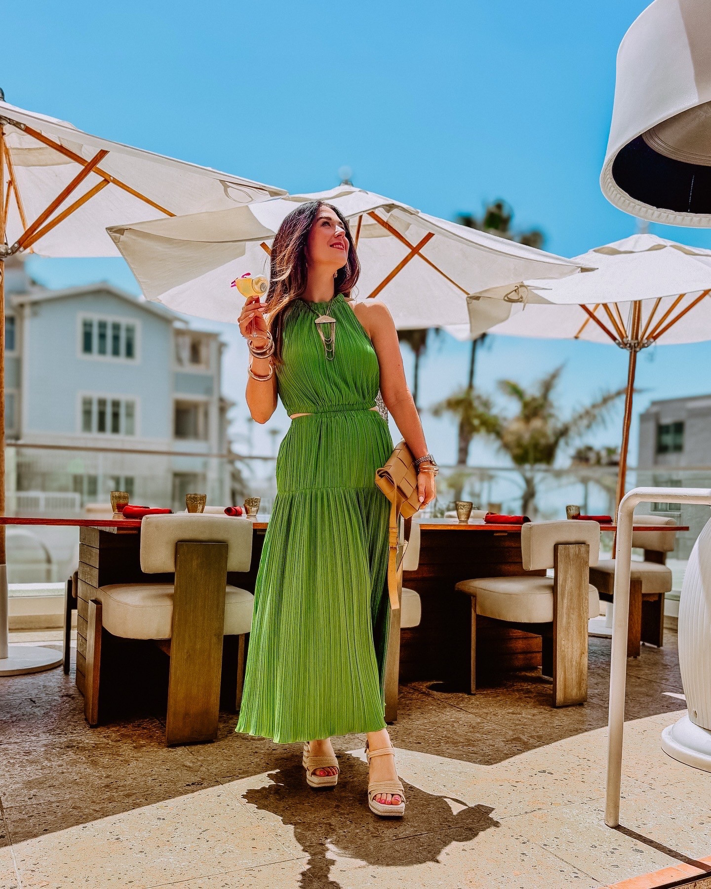 Summer lunch look 🌿 This pleated green maxi dress is breezy and elevated — the side cutouts give it that extra edge. I styled it with bold vintage gold jewelry for a luxe touch and finished the look with my woven Quince crossbody that’s such a chic Bottega dupe (at a fraction of the price). Linking everything you can shop now on my LTK 💚 #LTKStyle #LTKSummer #QuinceFinds #BottegaDupe #SummerOOTD #GreenDressVibes #ChicAndEffortless #AffordableLuxury #StyleInspo 