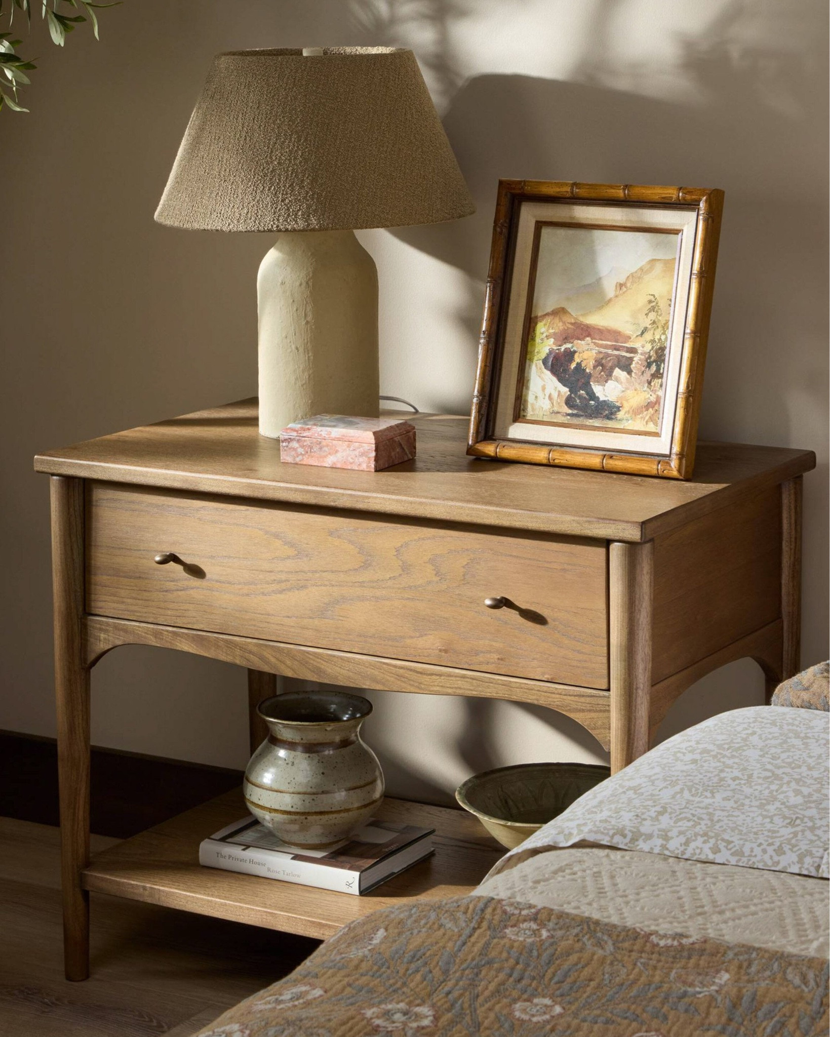 Soft arches and rounded lines give this nightstand a warm, vintage-leaning profile with restrained detail. We love this large nightstand for adding spacious bedside storage with understated impact.

#LTKHome