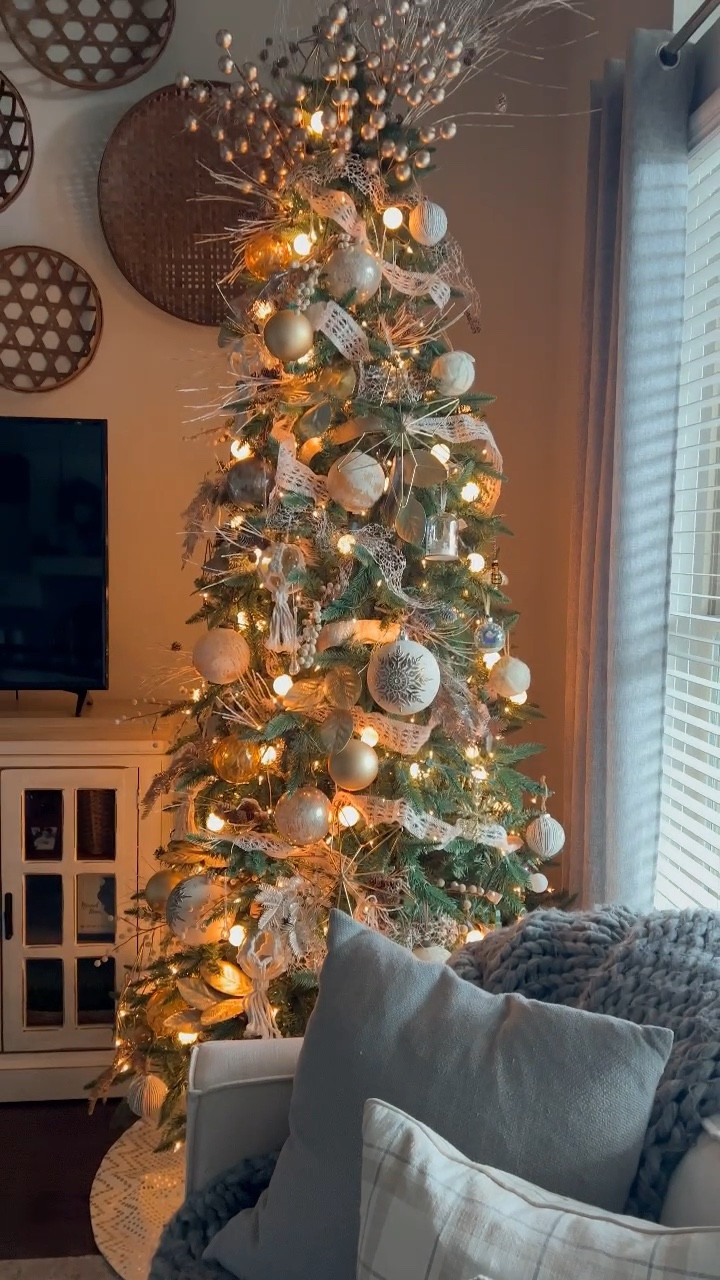 My gold and ivory Christmas tree, similar decor is linked here!

#chiconashoestringdecorating

#LTKHome #LTKSeasonal #LTKHoliday