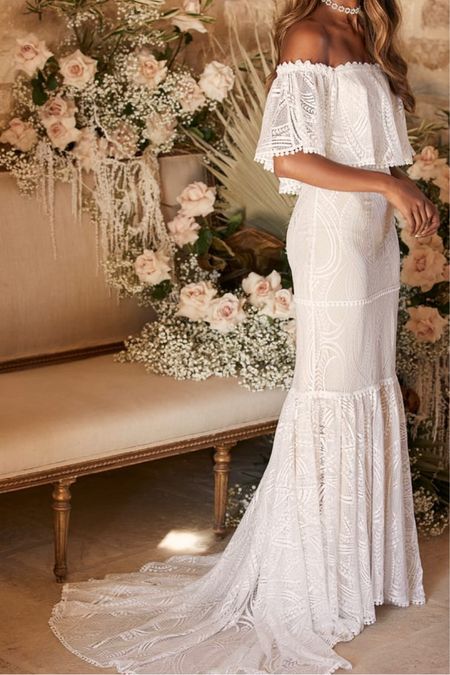 This off shoulder lace wedding dress is under $150. Pretty boho wedding dress!

#LTKwedding