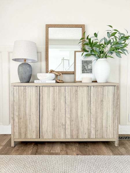 Love this Amazon sideboard. Such great quality!  Color is sunwashed ash oak, 

Sideboard, accent cabinet, table lamp, lamp, vase, large vase, decorative bowl, faux greenery, artwork, home decor, table decor, shelf decor, neutral decor, Amazon home, Amazon finds 

#LTKfindsunder100 #LTKsalealert #LTKhome