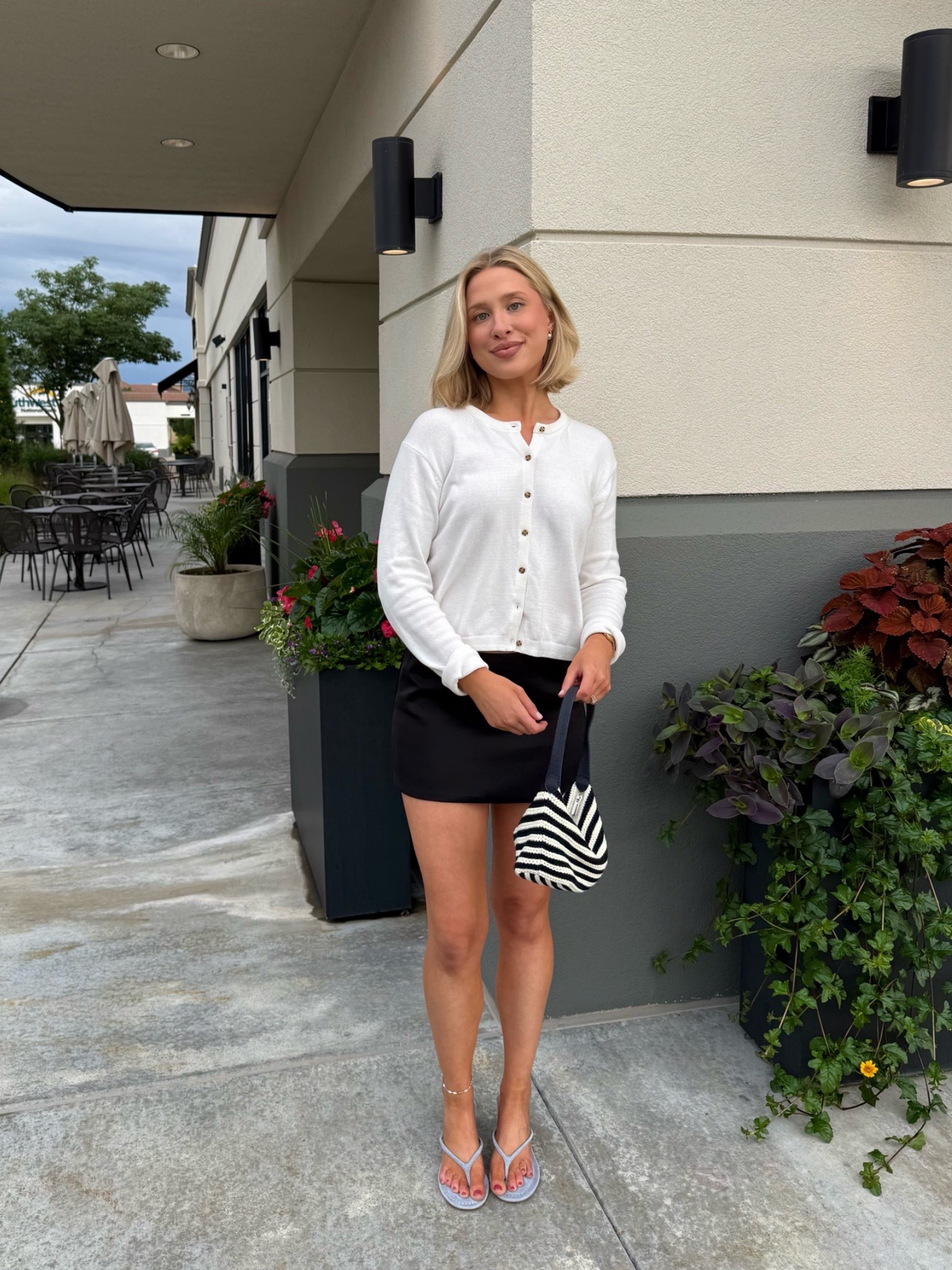 Loving this crochet striped mini bag from Gap!
My white cardigan is also from Gap! Size S
Princess Polly black satin skirt in size 4 (I’m 5’7”)
Amazon light blue heeled sandals & gold watch

#LTKootd