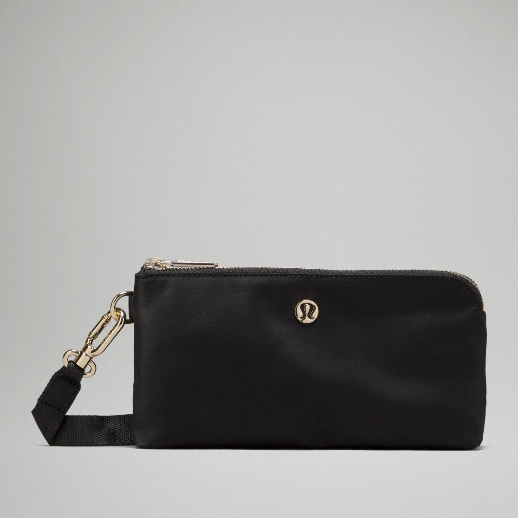 This black and gold Lululemon wristlet just went on sale! #lululemon 

#LTKsalealert #LTKfindsunder50