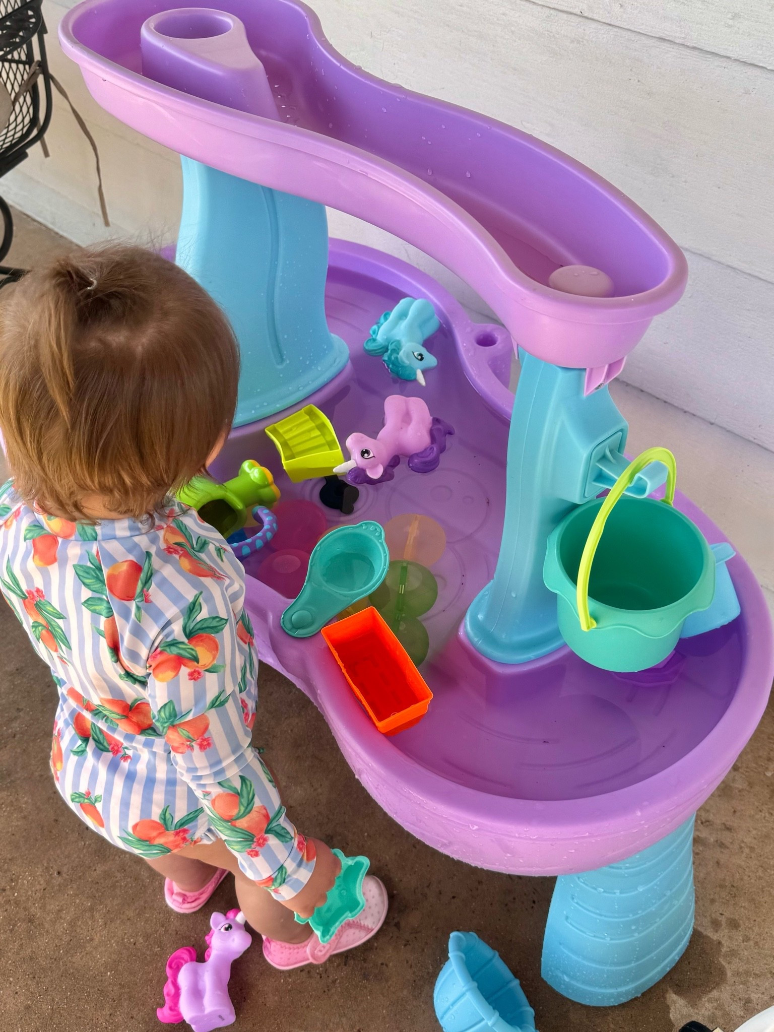 Proof that toddlers don't need much to have the best day ever: water, sunshine, and a unicorn water table. 🦄☀️💦

This has easily become one of our most-loved outdoor toys. My little one has always been a water bug, and it's one of the few activities that keeps her entertained while encouraging hours of outdoor play.

One of my favorite things about water tables is how easy they are to refresh and reinvent. We've had so much fun adding new accessories throughout the summer, and I've linked both the toys we currently use and a few items that are still on my wish list.

I also had to include the daisy towel because it's genuinely one of my favorite finds. It's thick, soft, washes beautifully, and feels much more luxurious than your average kids' towel.

For those wondering about the swimsuit, the exact one is no longer available from Old Navy, but I've linked a few similar styles that have the same sweet, whimsical feel.
Some of our favorite summer memories have been made right here—just a little water, a handful of toys, and lots of imagination. ☀️💛 #watertablefun #waterplay #summerwithkids #toddlersummer #toddleractivities #sensoryplay #backyardplay #summertoys #LTKKids
#LTKFamily
#LTKHome
#WaterTable
#WaterTableFun
#WaterPlay
#BackyardPlay
#SummerWithKids
#ToddlerSummer
#ToddlerActivities
#OutdoorPlay
#OutdoorPlayIdeas
#SummerPlay
#SummerFunForKids
#SensoryPlay
#OpenEndedPlay
#PlayBasedLearning
#ToddlerMom
#MomLife
#MotherhoodUnplugged
#WhimsicalChildhood
#MagicOfChildhood
#SimpleChildhood
#ChildhoodUnplugged
#MontessoriInspired
#MontessoriToddler
#IntentionalParenting
#KidsOutdoorActivities
#BackyardChildhood
#SummerMemories
#MomFinds
#ToyRotation
#OrganizedMom
#KidsPlayIdeas
#ToddlerMustHaves

#LTKmomlife #LTKKids #LTKSaleAlert