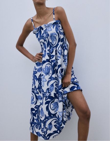 Blue and white patterned smocked midi dress - summer outfit 

#LTKfindsunder50 #LTKSeasonal #LTKstyletip