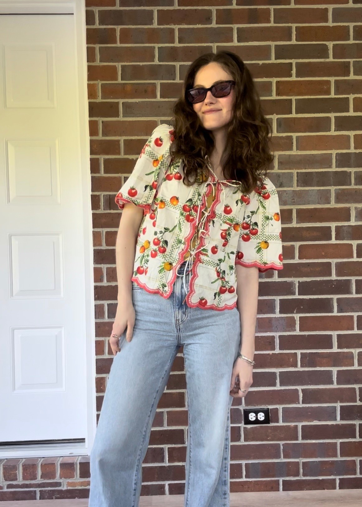 Cute little tomato tie front blouse from Anthropologie. It also comes in matching shorts to make a set 

#LTKSummerEdit #LTKFindsUnder100