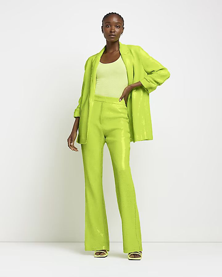 Lime green sequin flared trousers | River Island (UK & IE)