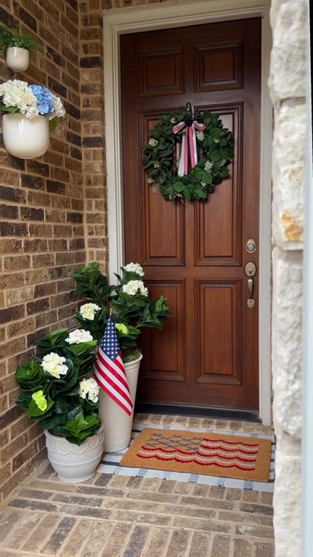 🇺🇸Giving our front door a little Americana summer refresh with faux hydrangeas, layered patriotic touches and all the cozy front porch charm. honestly it makes me so excited for backyard bbq’s, fireworks, popsicles and slow summer nights.

follow me @threetimesahome for more summer decor & hosting inspiration 💙 

#americanadecor #summerdecor #frontporchdecor #fauxhydrangeas #patrioticdecor

#LTKHome #LTKSeasonal