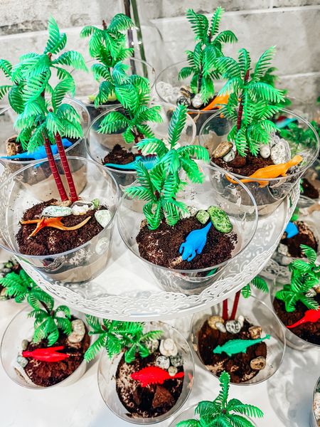 Dino themed birthday party cute dessert option - “prehistoric dirt”. I got the trees, dinosaurs, cups, and chocorocks on Amazon and it fit the theme perfectly!! 

Three-Rex. Boy birthday inspo. Kid dinosaur themed birthday party. Third birthday. Toddler birthday party. 

#dinosaurparty #boybirthdayparty #kidsparty #dinoparty

#LTKkids #LTKparties #LTKfamily