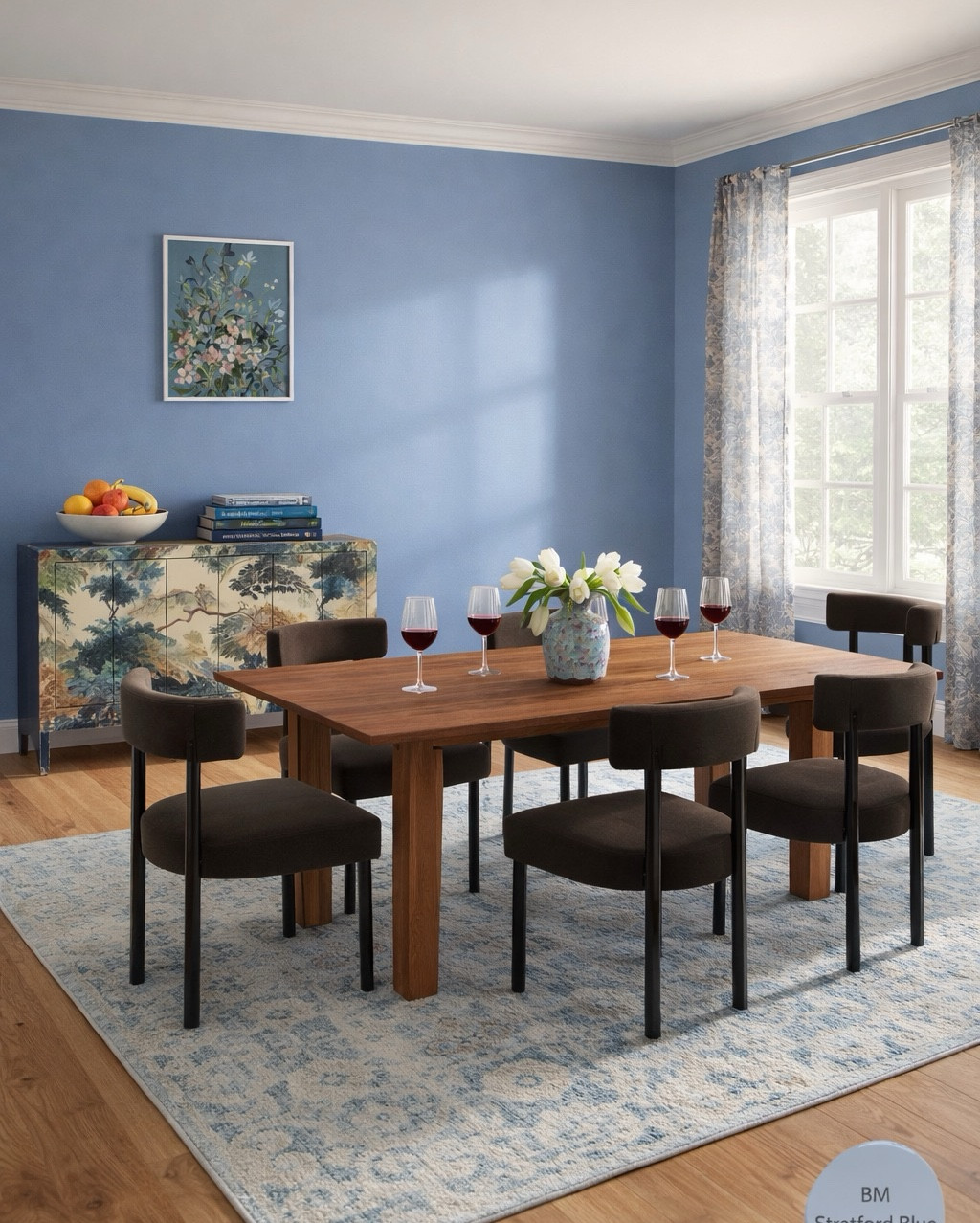 Beautiful Spring dining room design! I love this dining table from Wayfair, upholstered velvet chairs (there are different colors), beautiful sideboard from Anthropologie, floral curtains, vintage blue rug, FLW placemats and green dining set. #homedecor #diningroom 

#LTKFamily #LTKHome #LTKSeasonal