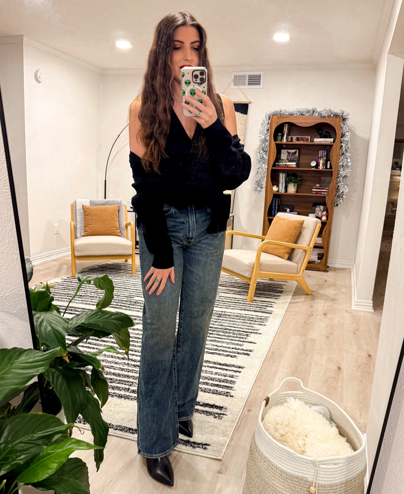 An easy, everyday outfit that still feels polished. A classic black top layered casually with straight leg denim and finished with pointed black boots. Comfortable, timeless, and perfect for errands, casual dinners, or WFH days when you still want to look put together.

#LTKFindsUnder100 #LTKWorkwear #LTKootd