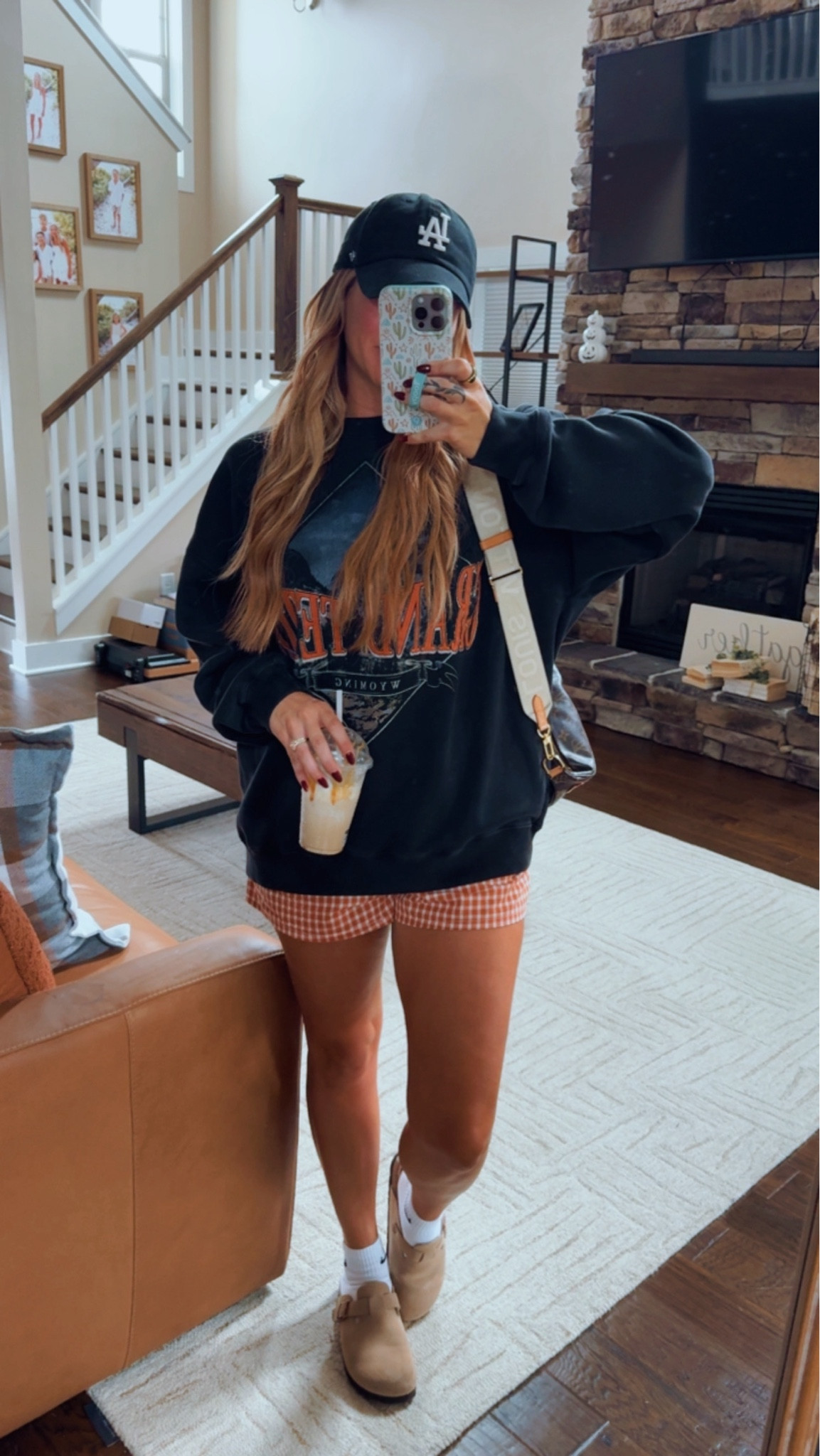 A comfy cozy oversized graphic sweatshirt from Abercrombie paired with a trendy checkered boxer short and clogs with Nike socks is the perfect rainy day Fall outfit 

#LTKShoeCrush #LTKFindsUnder100 #LTKSeasonal