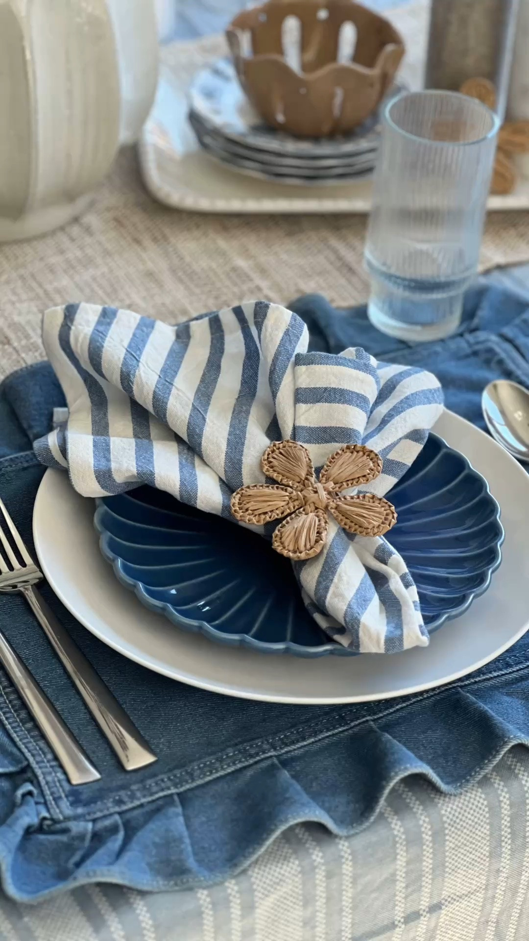 Late summer table decor, blue and white place setting, denim placemat, ruffled placemat, blue salad plate, white dinner plate, striped linen napkin, woven napkin ring, raffia napkin ring, natural texture table decor, indoor outdoor tablescape, casual summer table, coastal table decor, summer hosting ideas, modern hostess style, neutral and blue tablescape, easy place setting ideas, layered table setting, summer dining decor, blue table accessories.

#LTKHome #LTKSeasonal