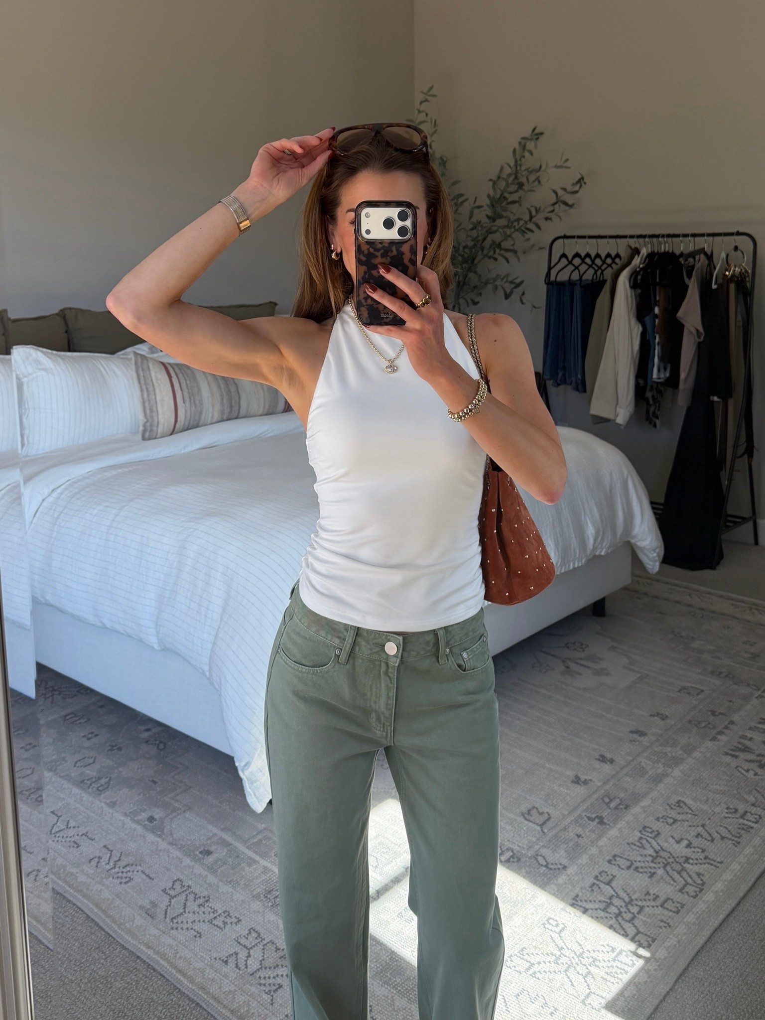 Easy outfit I have on repeat: halter top and low rise denim. Wearing size small in top and size 25 in jeans.

#LTKgrwm #LTKootd #LTKBeauty